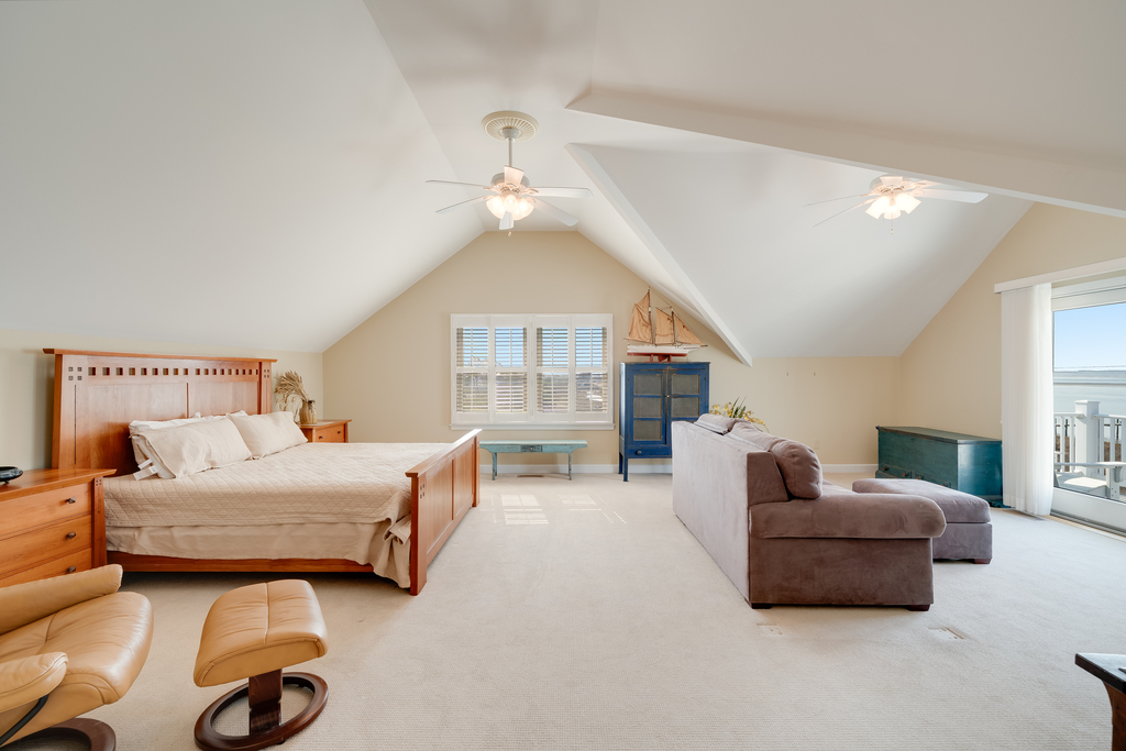 Located on the top floor, Bedroom 1 is a huge Primary Loft Bedroom with a King Bed.