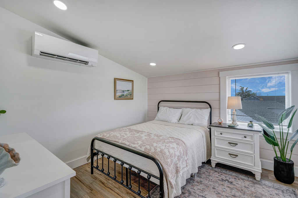 Wrought Iron Bed and tons of Natural Light are warm and welcoming.