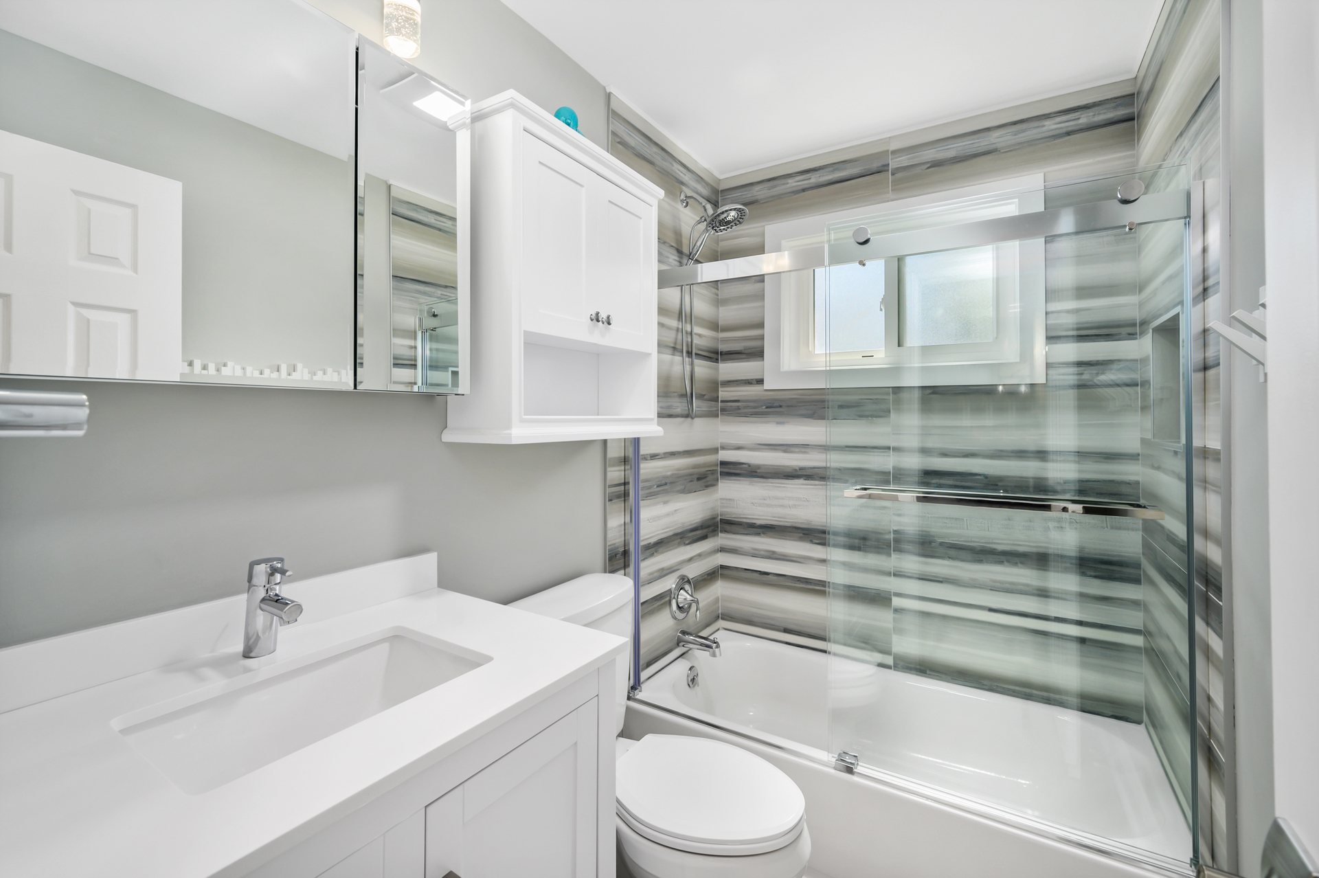 Spacious, full shared bath with stunning shower/tub combo!