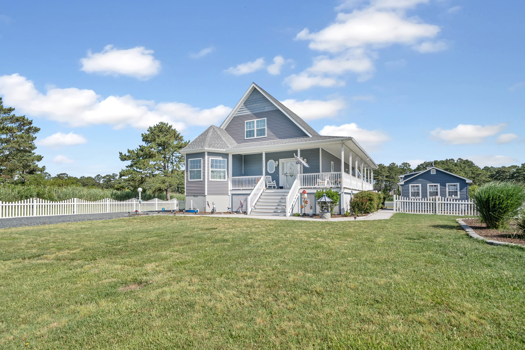 This statuesque home sits waterfront in prestigious Oyster Bay.