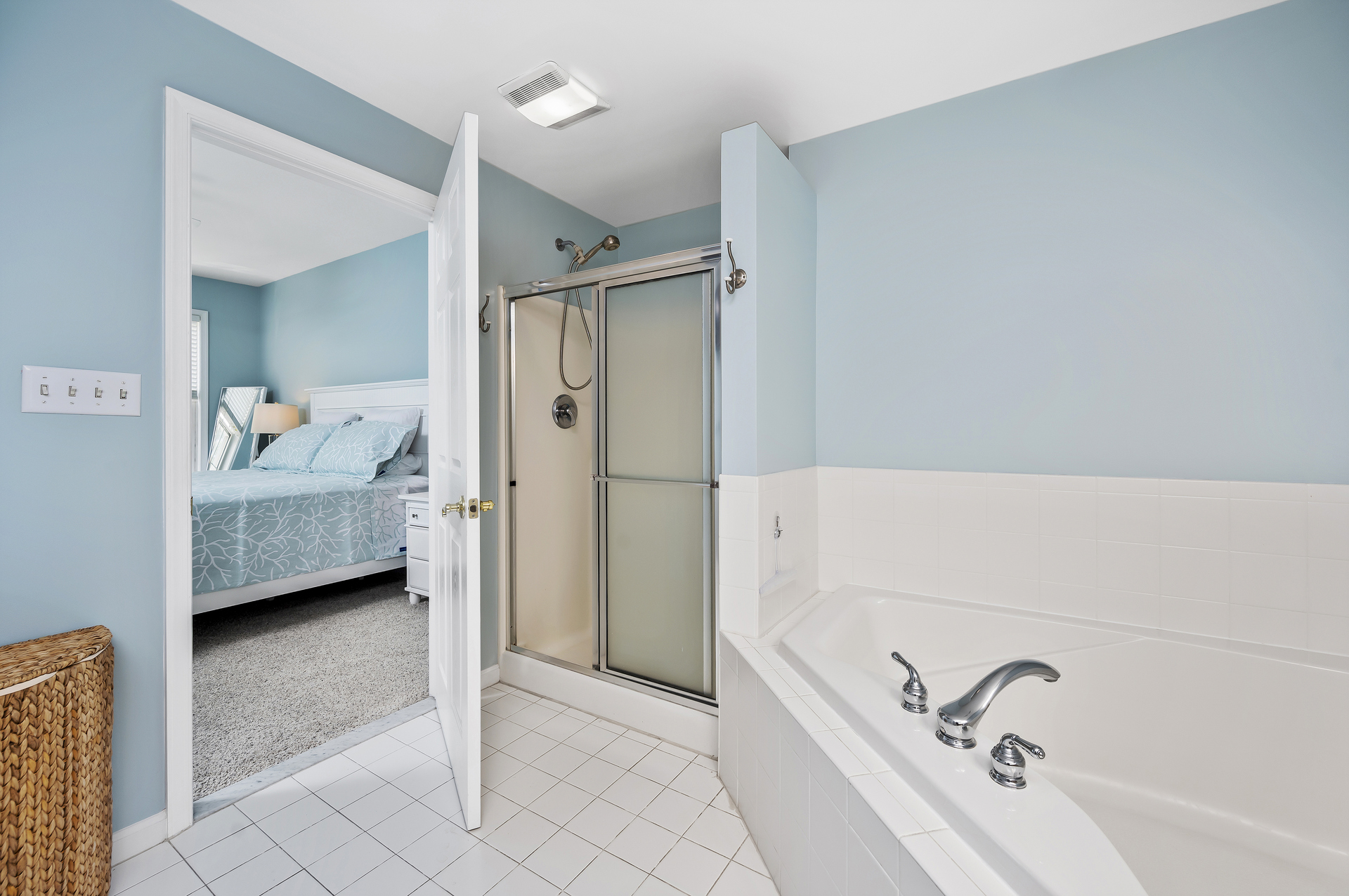 THE definition of a Primary Bathroom with walk in shower, soaking tub, private water closet and even a Smart TV