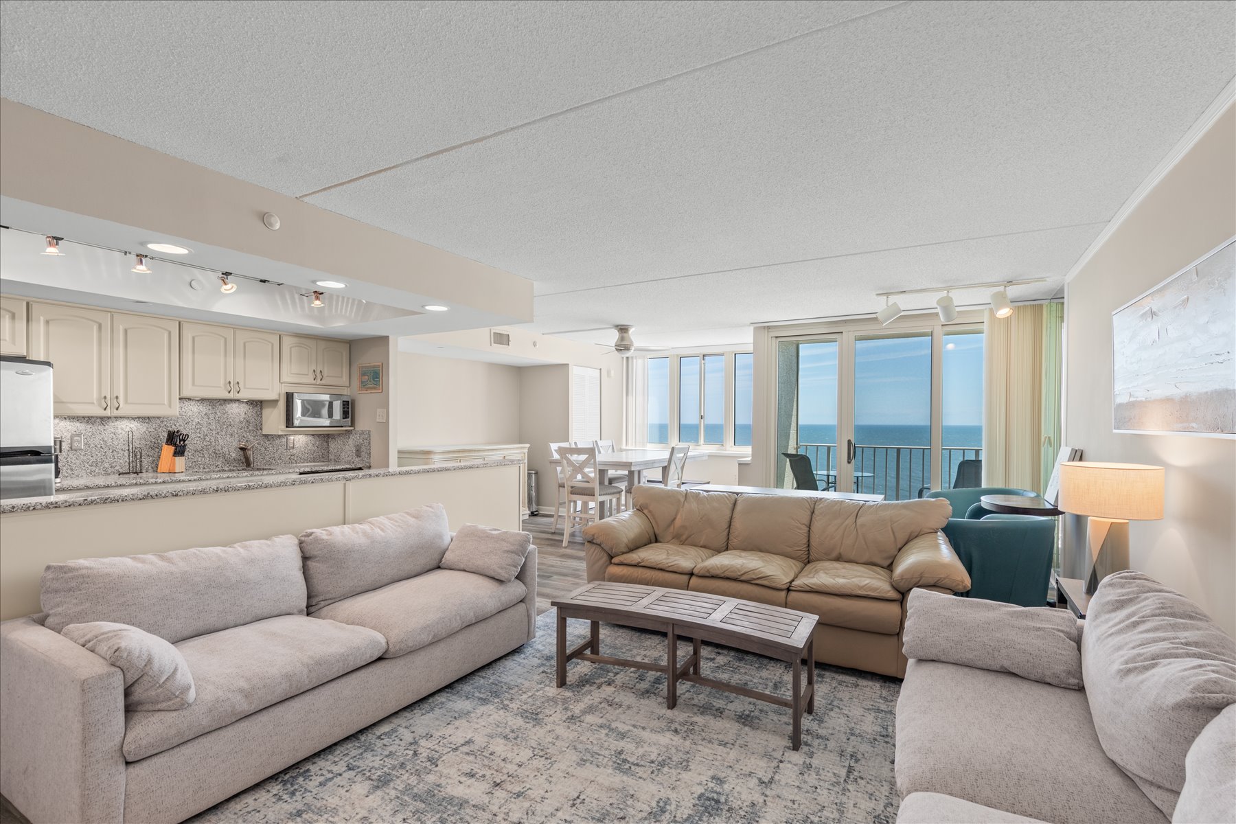 This expansive, open-concept living space is perfect for gathering the whole family together after a day in the sun.