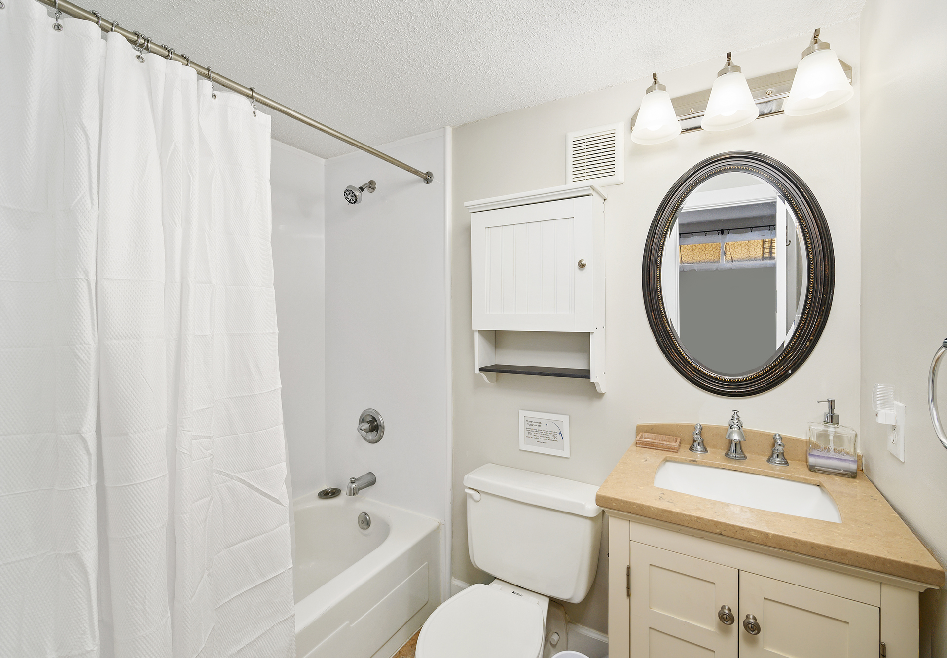 Bedroom 2 also has a private bathroom with a shower/tub combo.