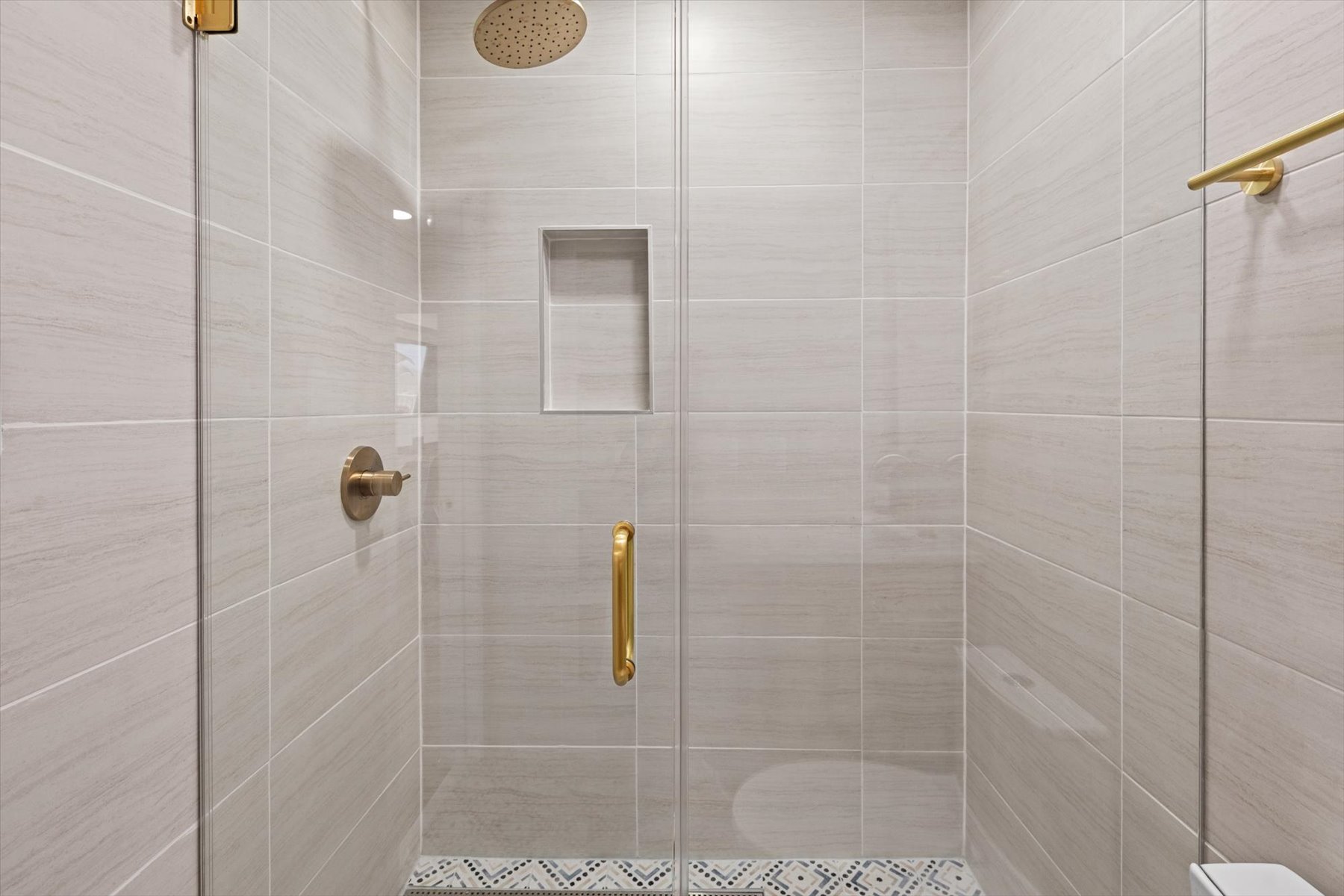 Custom-tile walk-in rain shower.
