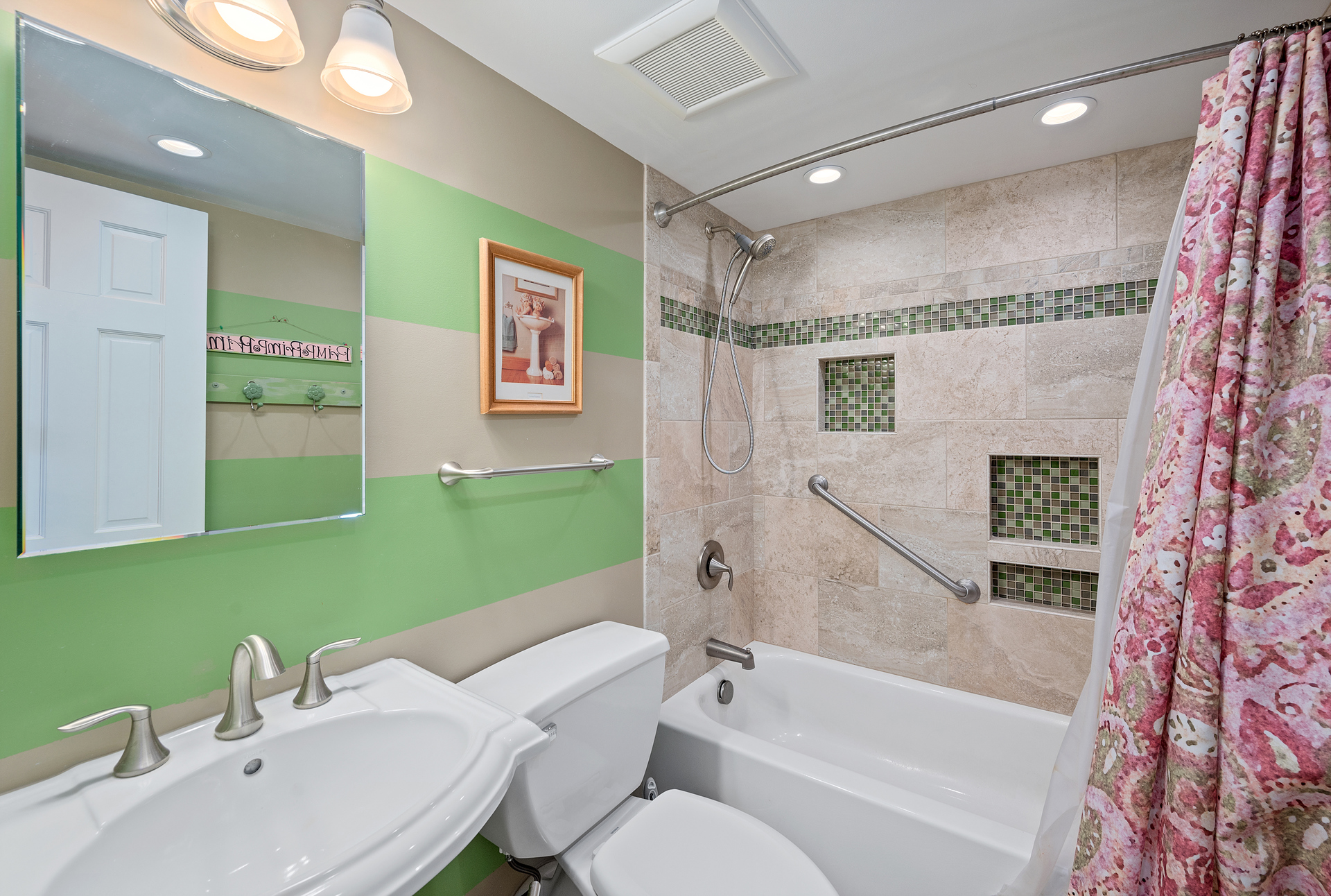 Full Shared Bath features a Custom Tile Shower/Tub Combo.