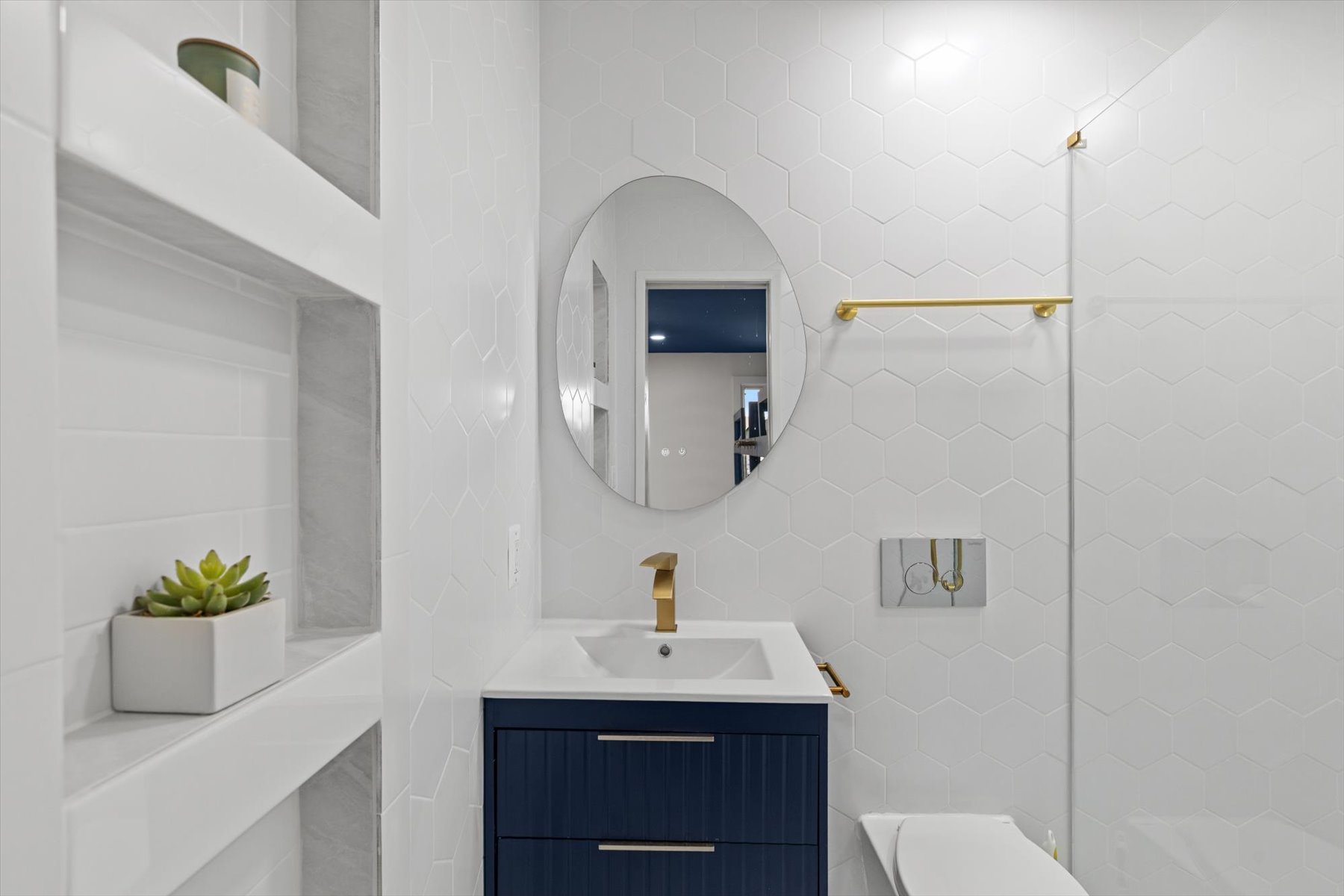 Modern and bright full bath.