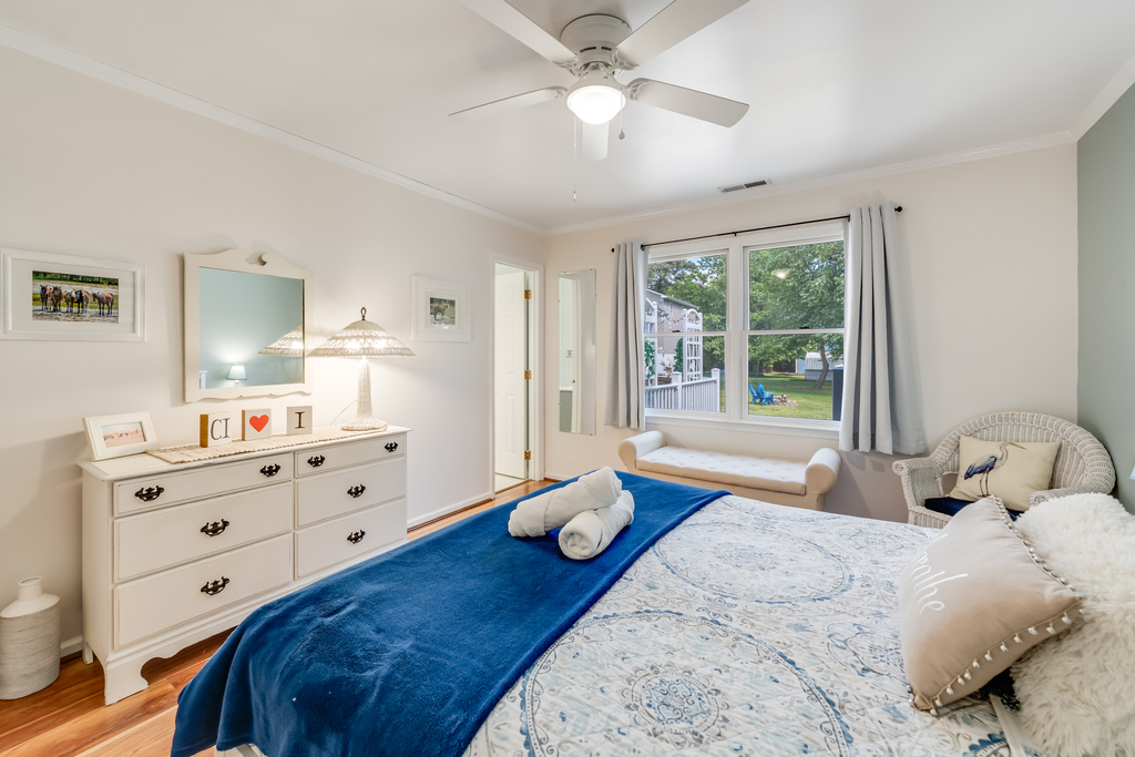 Master Bedroom has a comfy King Bed and lovely Yard Views.