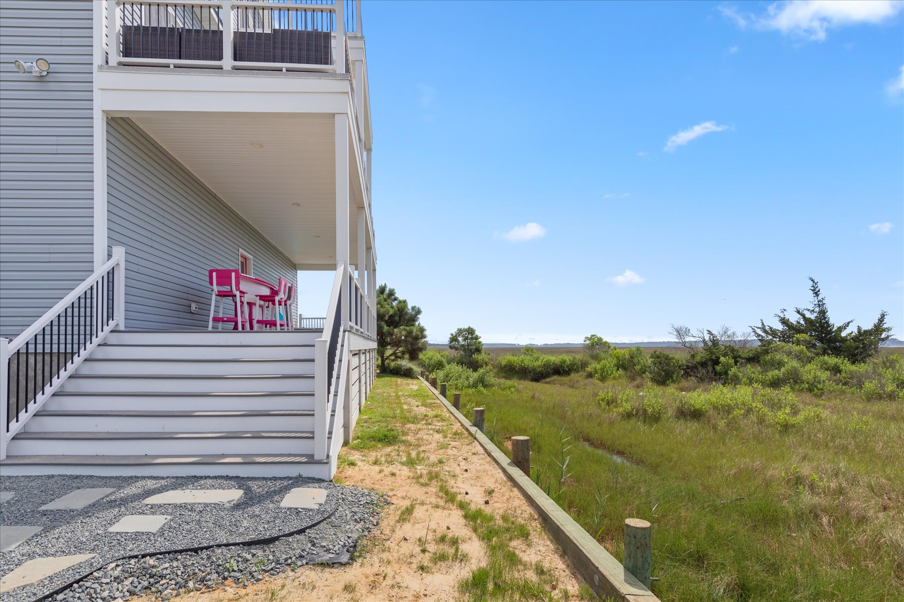 Wander down just a few steps to the Backyard Patio.