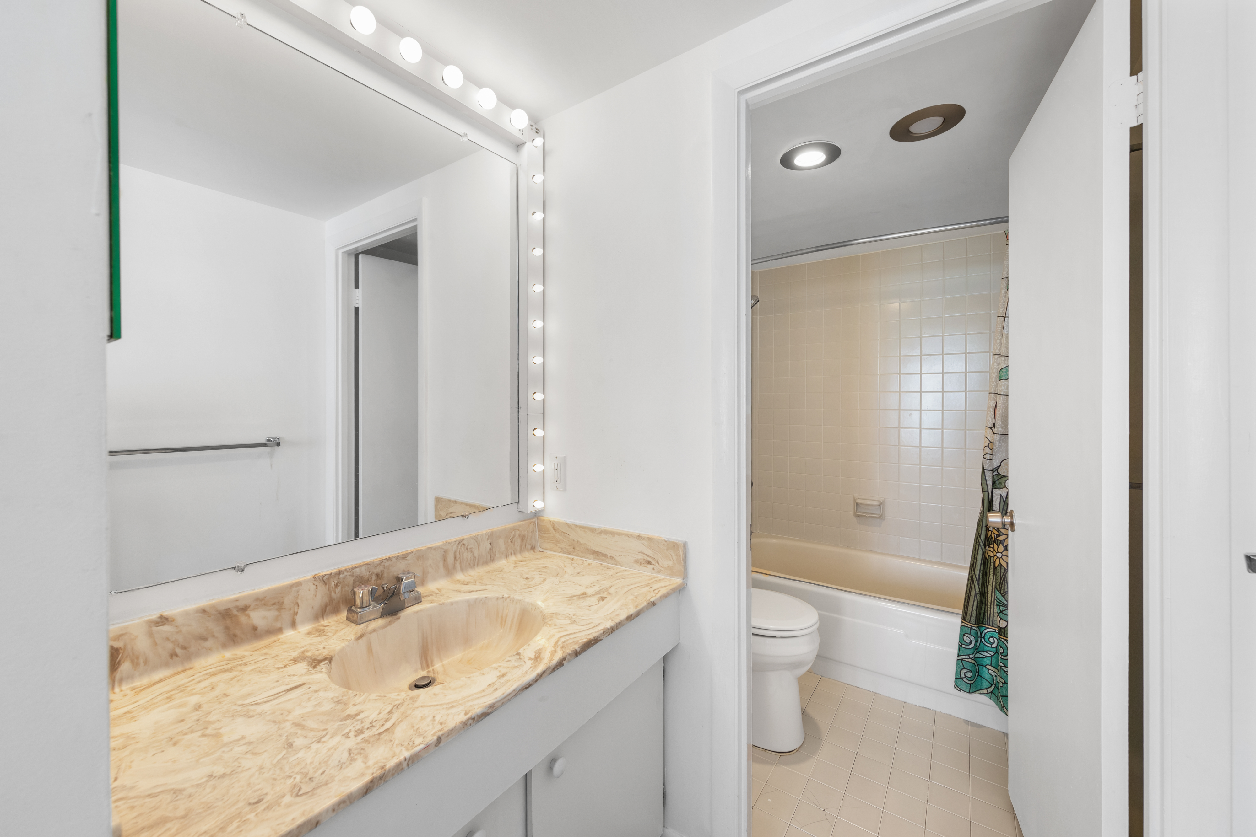 The Primary Bath has a Shower/Tub Combo