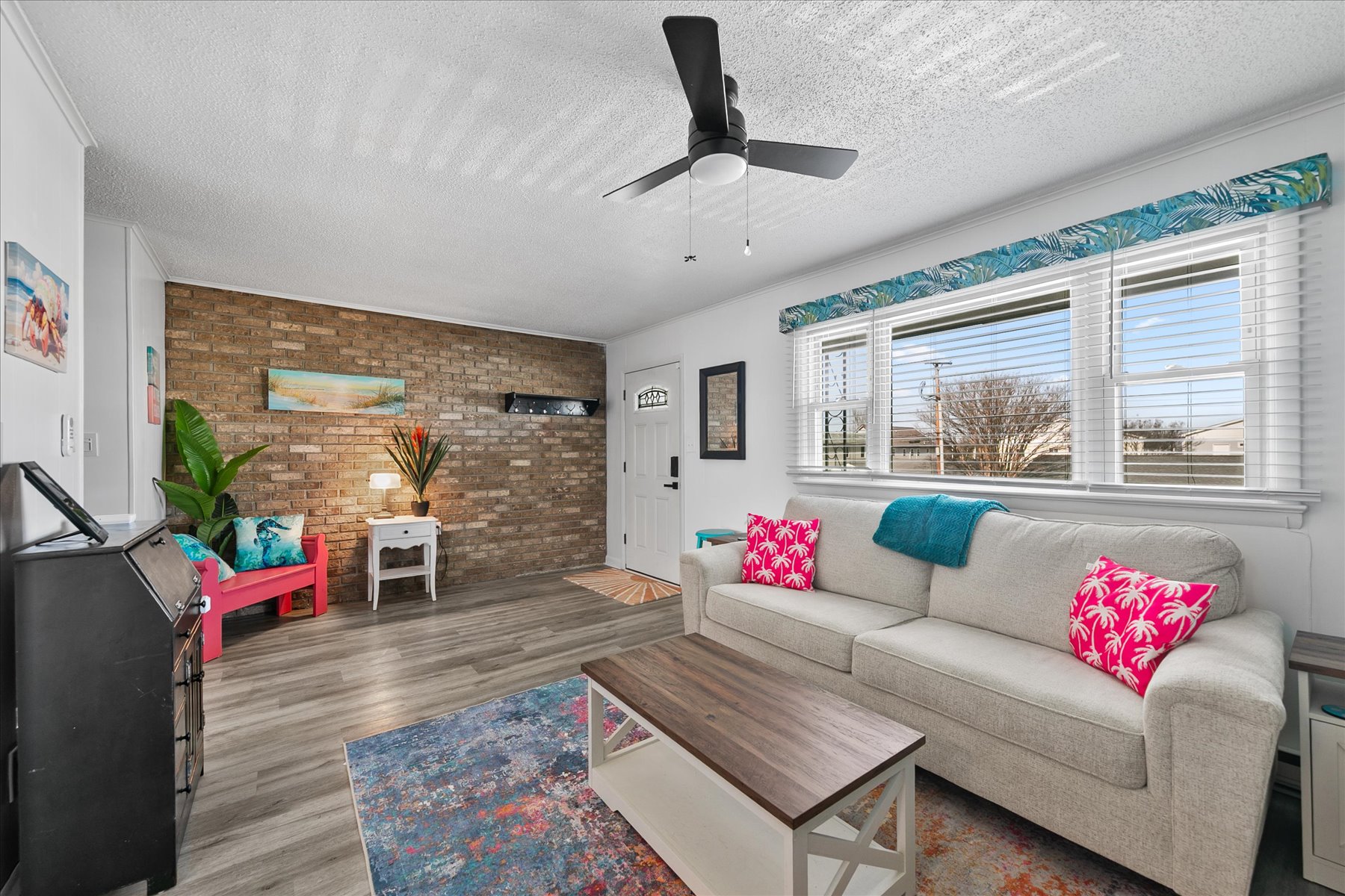 Thoughtfully renovated the beautiful floors and bright colors welcome you right in