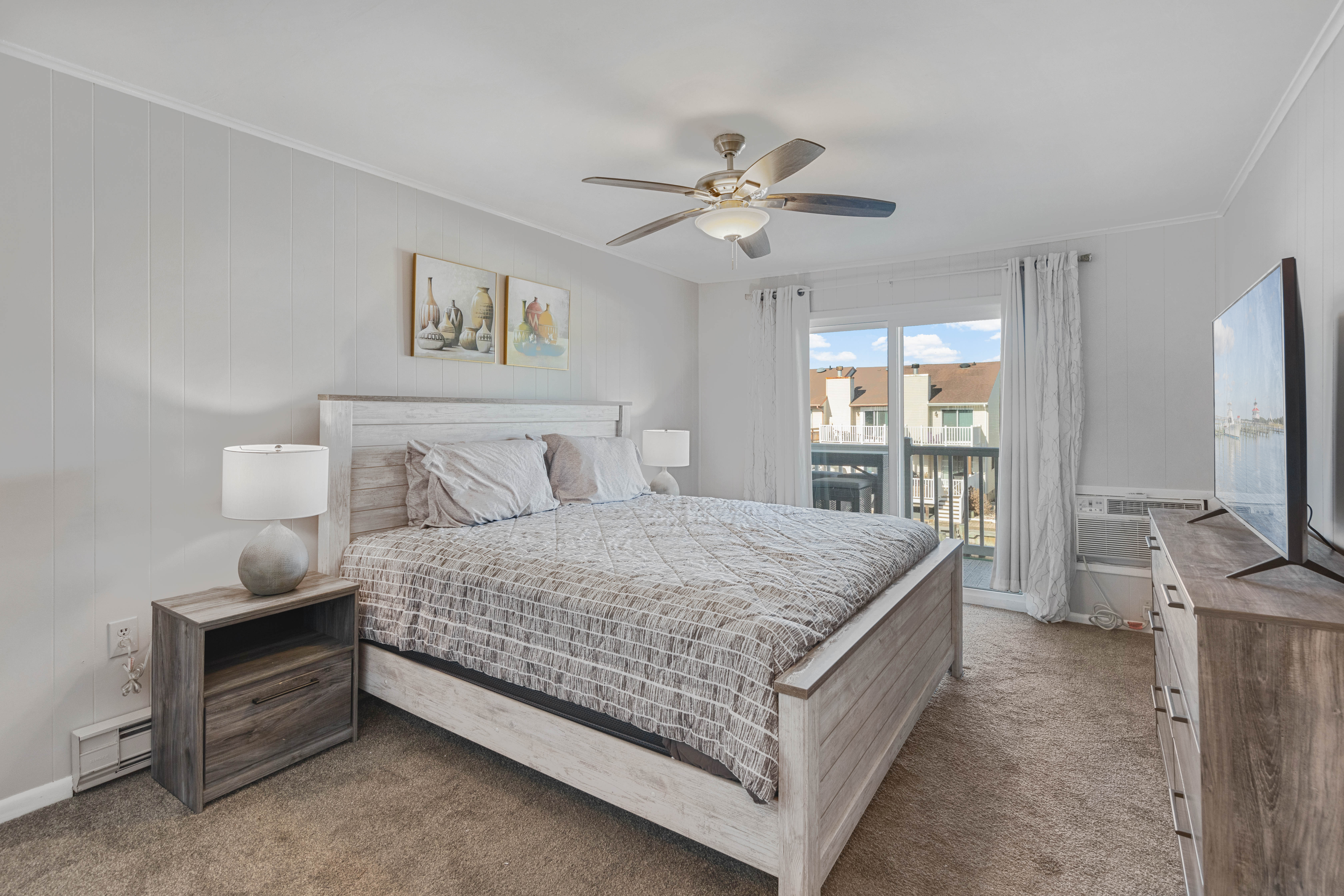 Check out this serene Primary Bedroom with private balcony access.