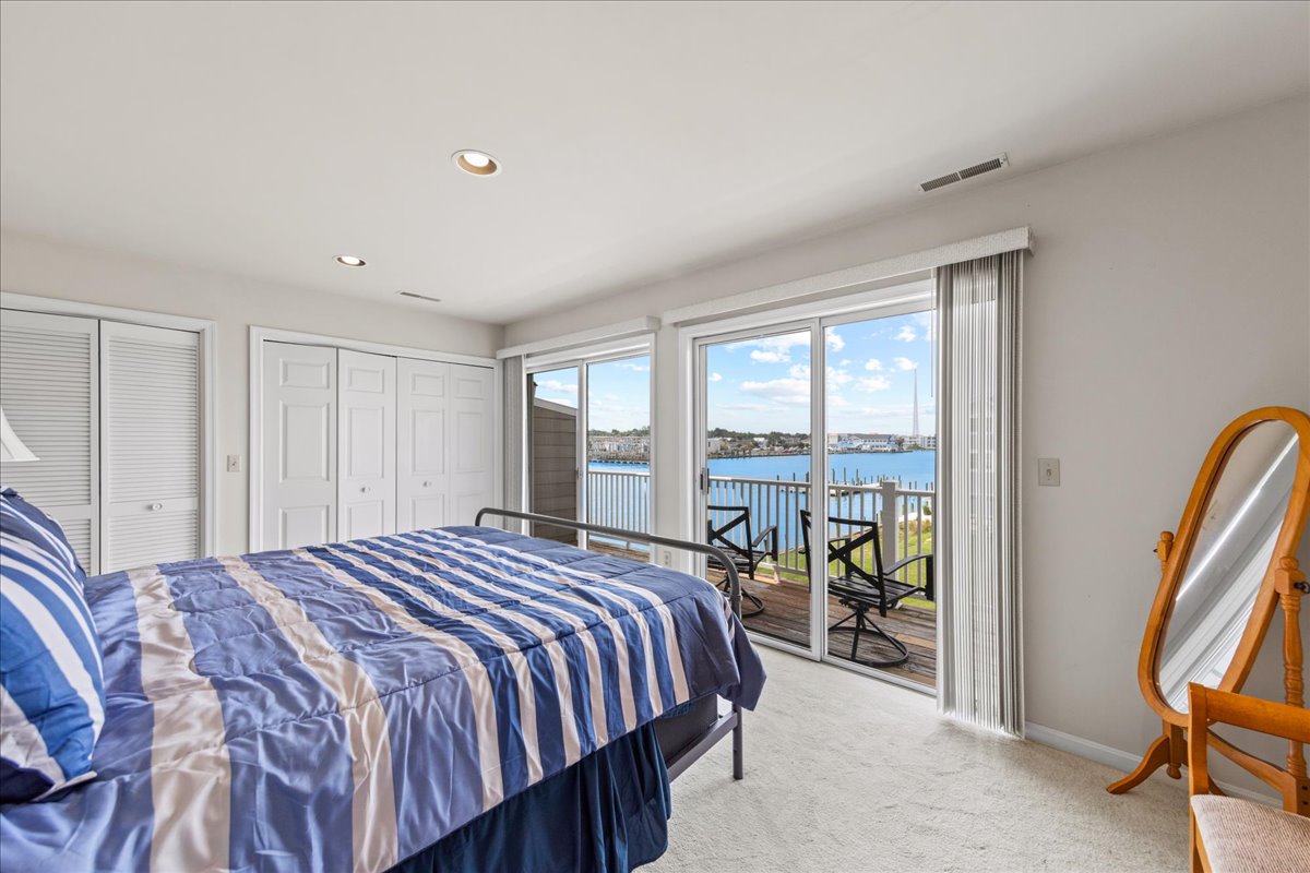 Bedroom 1 has a comfy King Bed and exquisite Bay Views.