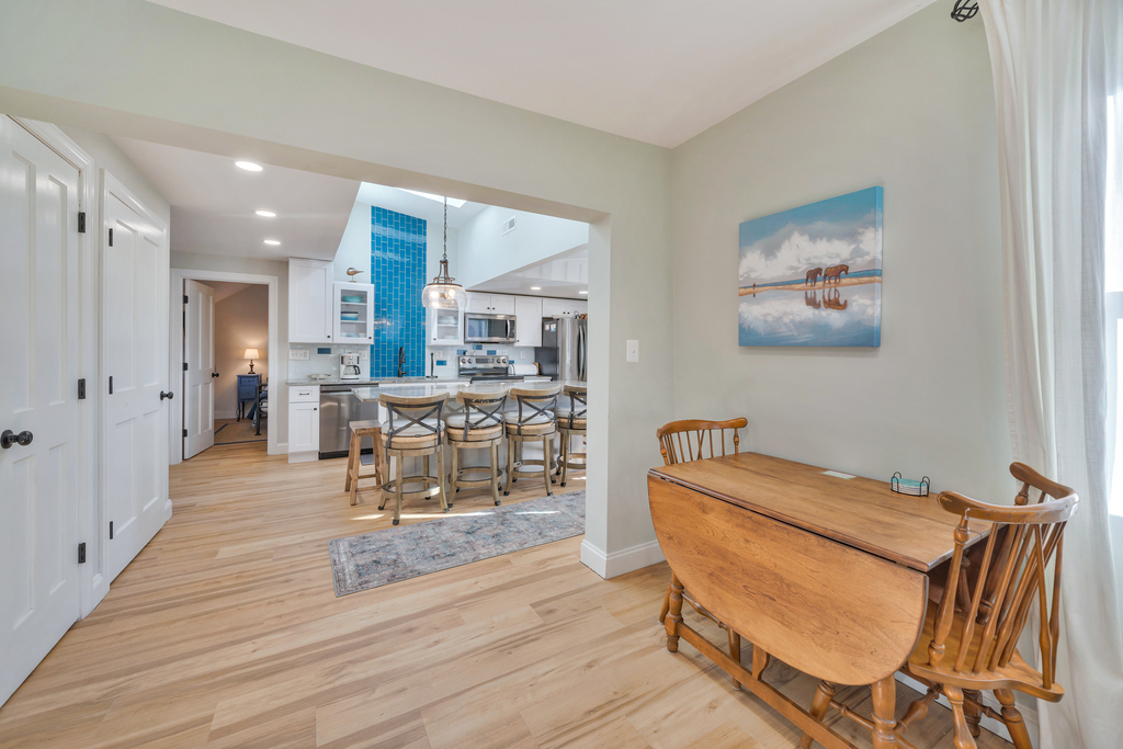 Small table has 2 leaves to accommodate the whole gang if needed.