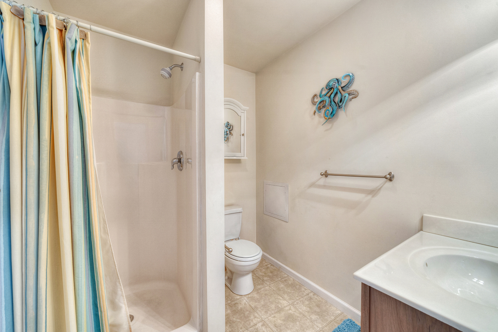 Attached Full Bath with Walk-in Shower.