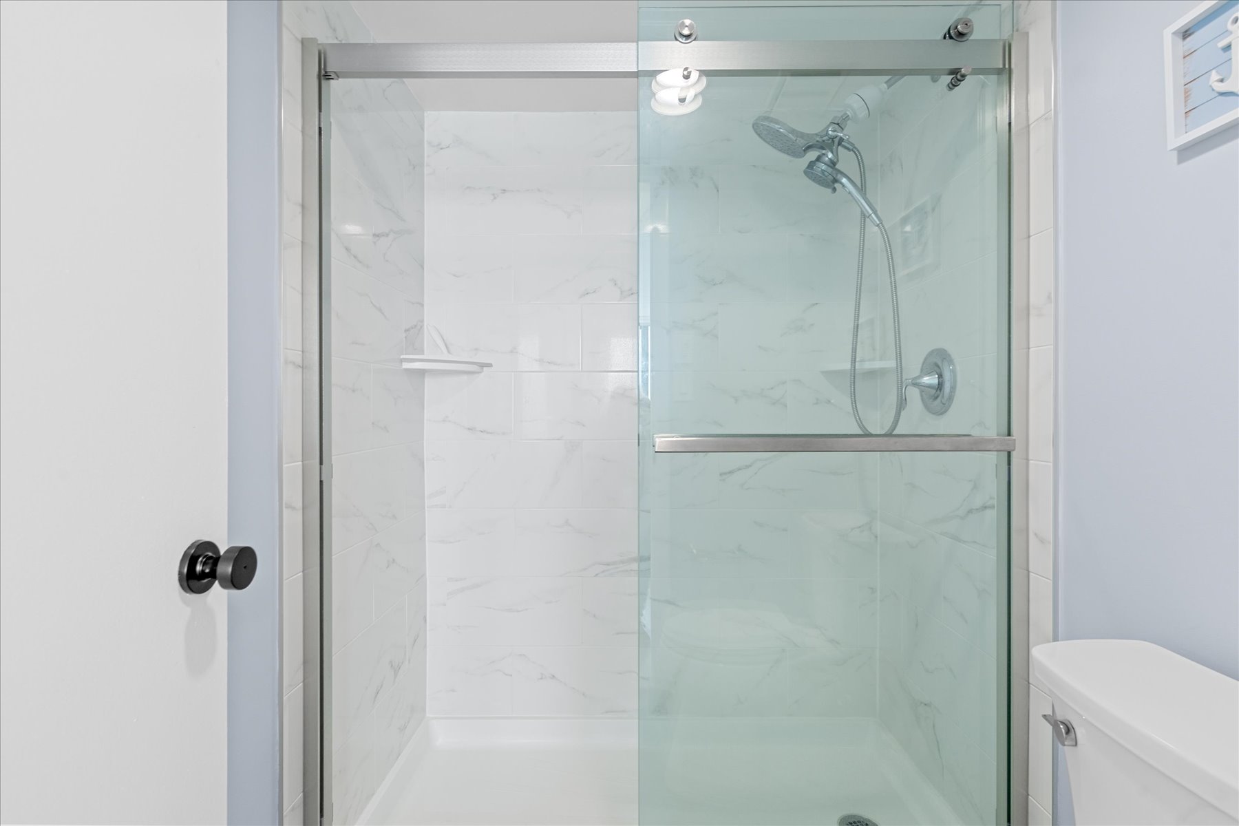 The Primary Bath offers a beautiful, glassed in Walk-in Shower