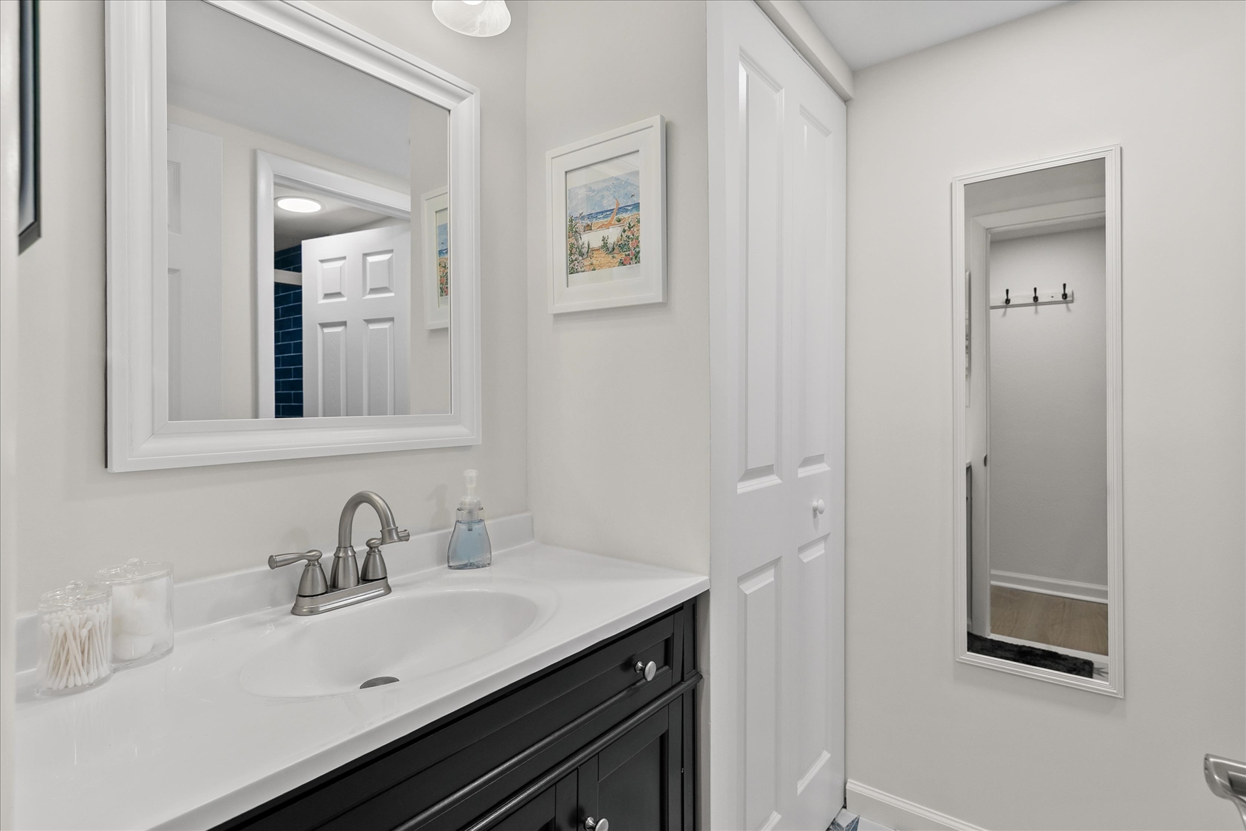 A clean, modern vanity with plenty of lighting to start your morning right.