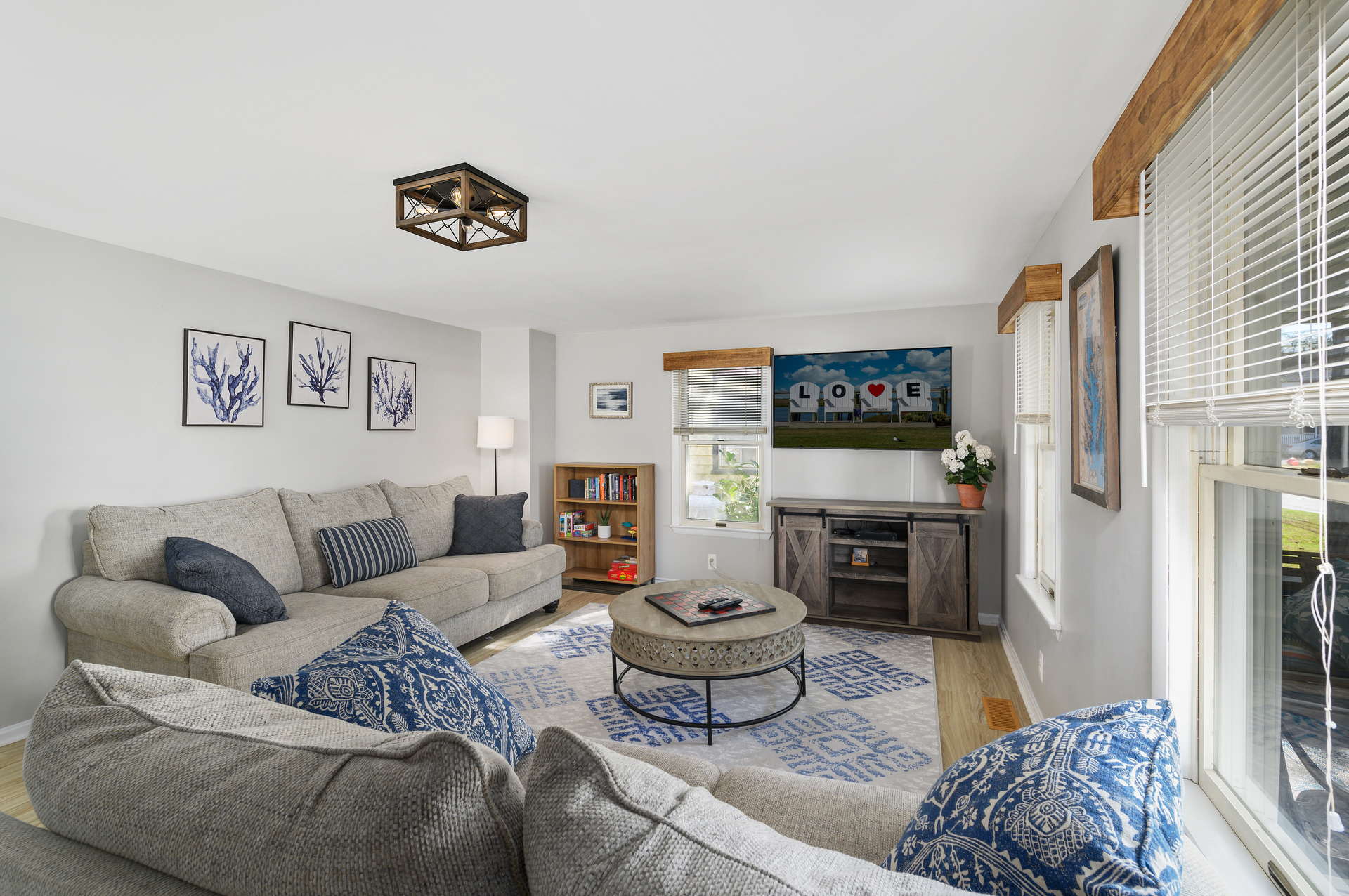 Relax in the Living Area with Coastal Colors, comfy Furnishings, and Flat Screen Streaming TV.