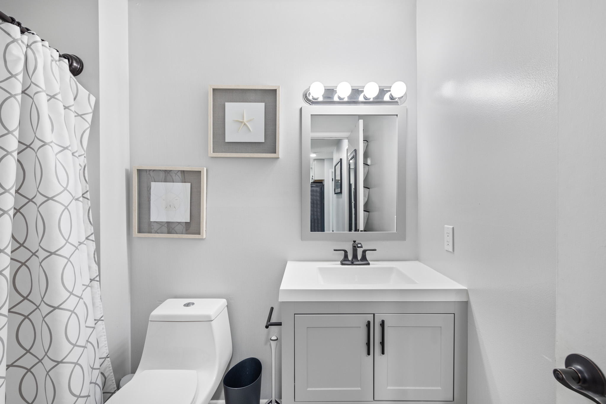 The Primary Bath is Bright and Beachy.