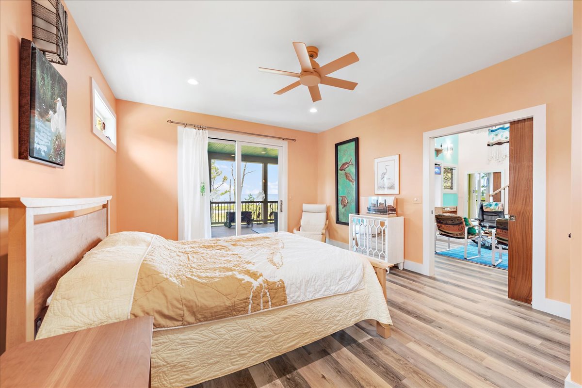 Bedroom 1 has gorgeous Bay Views and Private Access to the Waterfront Screened Porch.