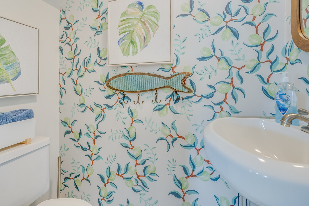 Pretty Half Bath convenient to Living Area.