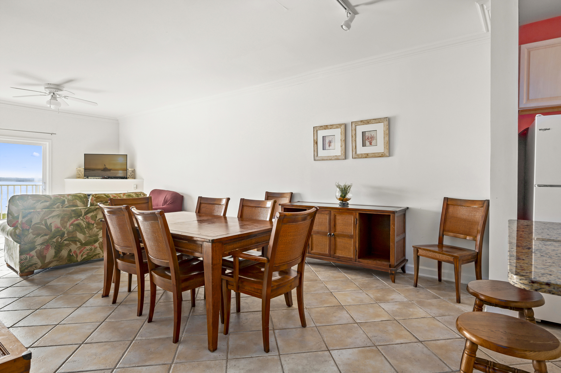 The dining table is at the center of this open living area