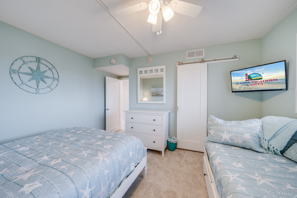 Ample sleeping arrangements make this bedroom flexible and perfect for families.