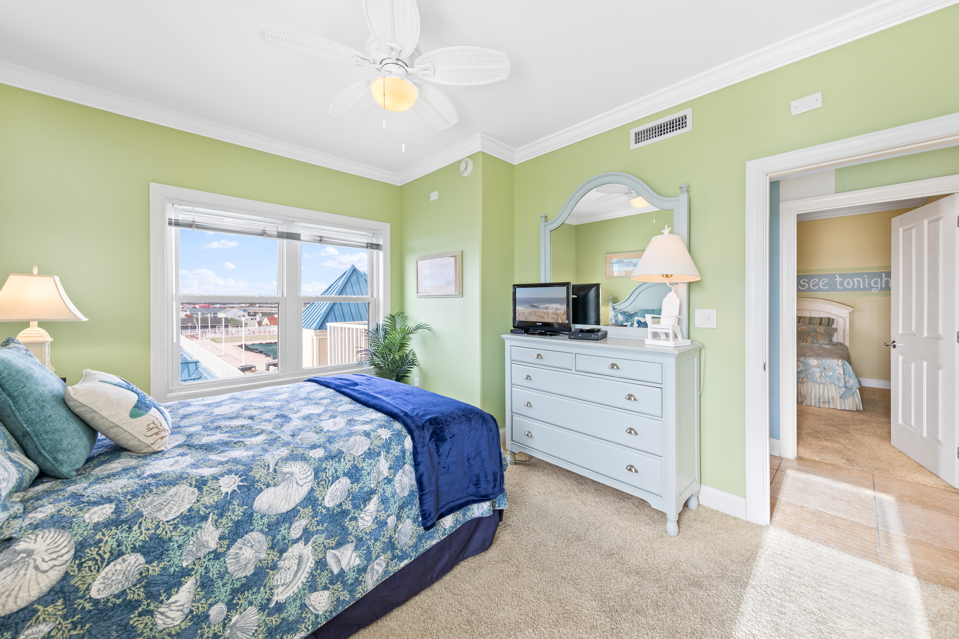 After a long day on the beach, unwind in the comfy bed with your favorite show.