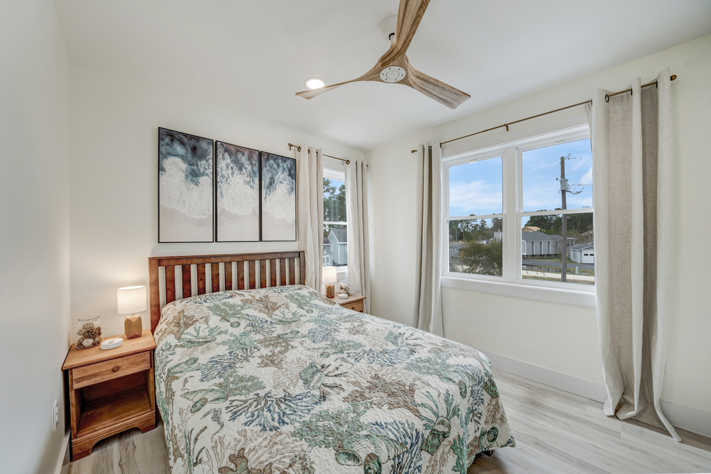 Bedroom 3 has a Full Bed and is adorned in colors of sand and sea.