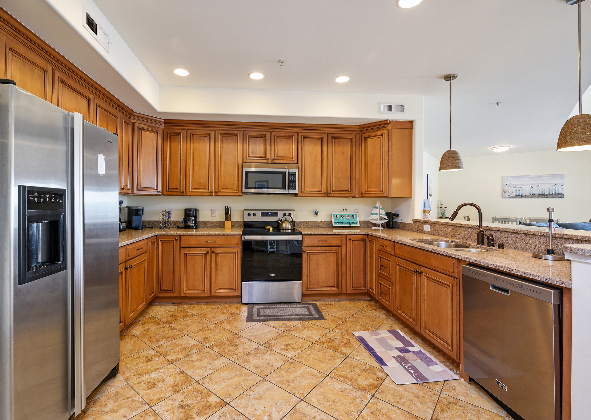Stainless Appliances and gleaming Granite Countertops.