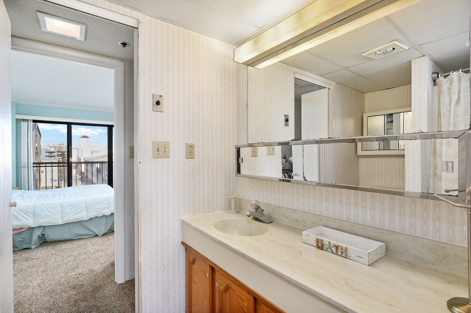 The shared Bathroom can be accessed from either bedroom and offers plenty of counter space and a large mirror