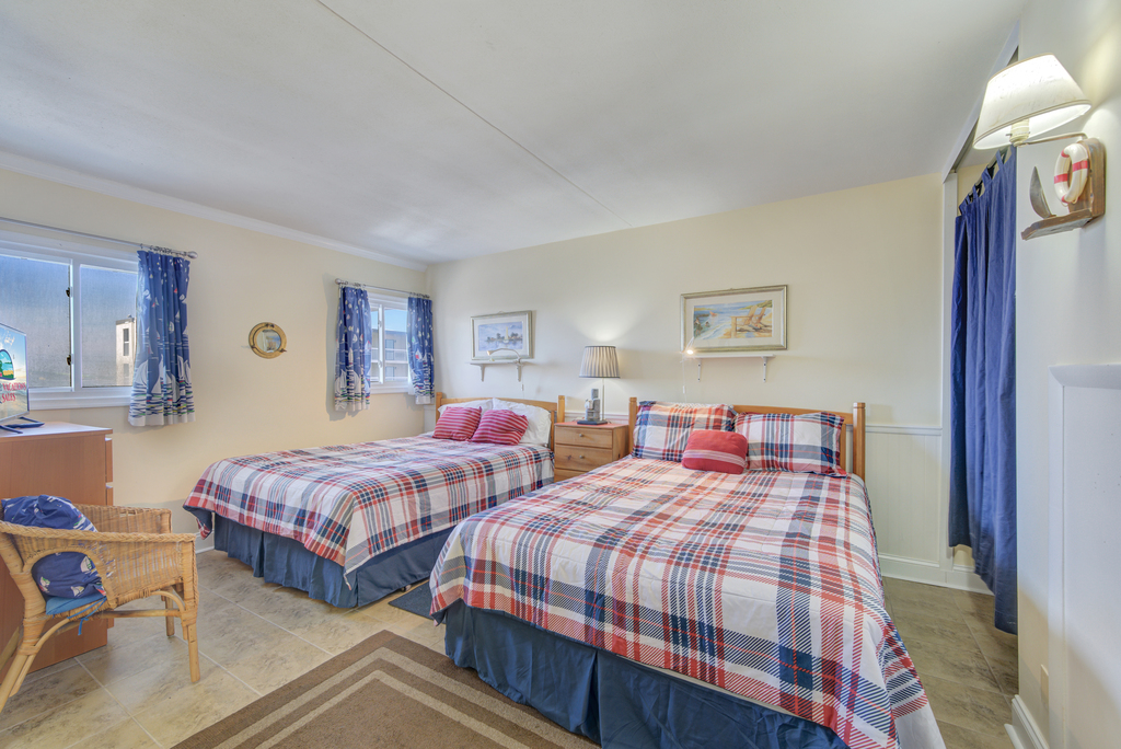 The bedroom features 2 cozy Queen beds!