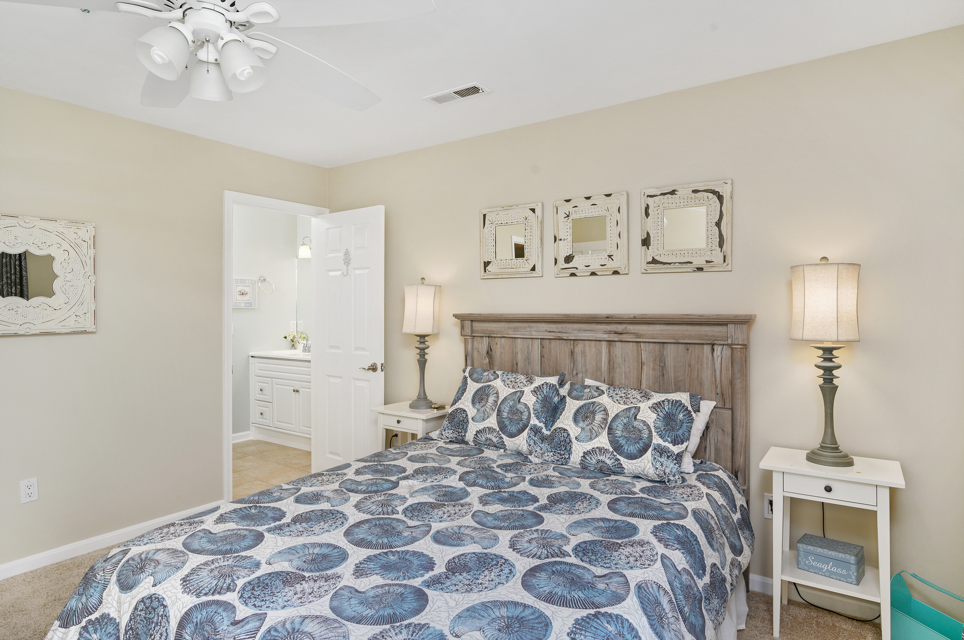 Colors of sand and sea throughout this Primary bedroom.