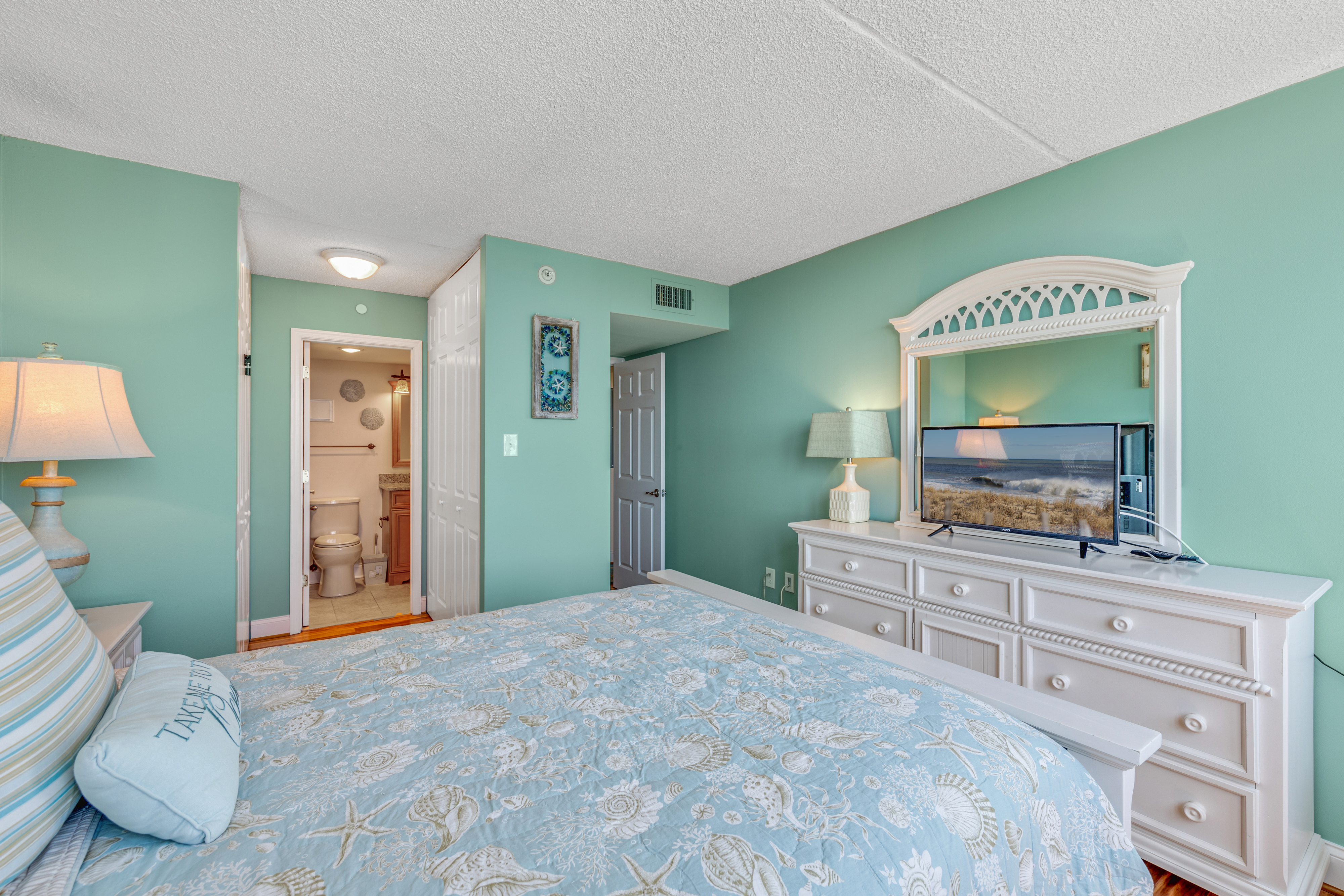 Gorgeous Colors of Sea Glass and Flat Screen TV.