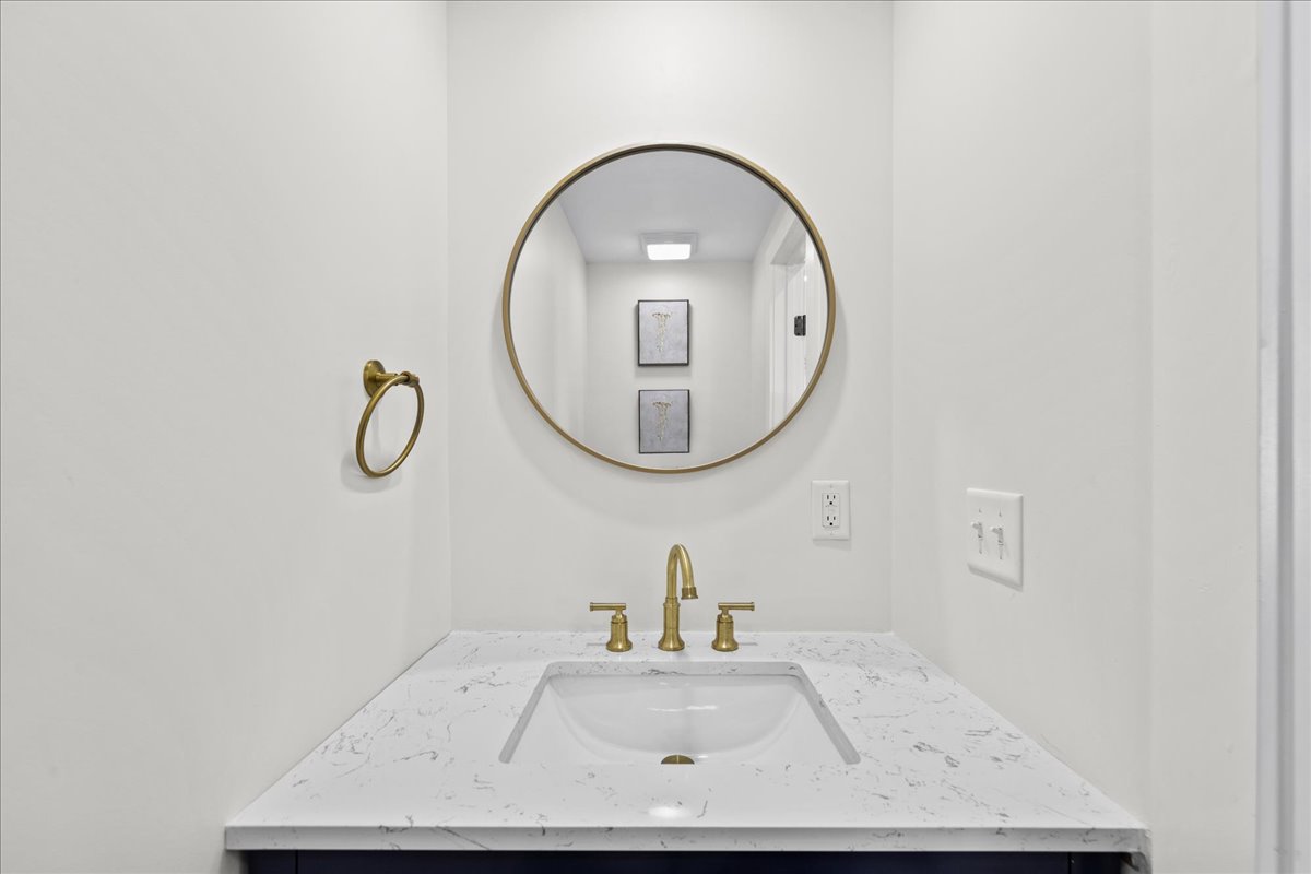 Convenient Half Bath just off Kitchen and Living Area.