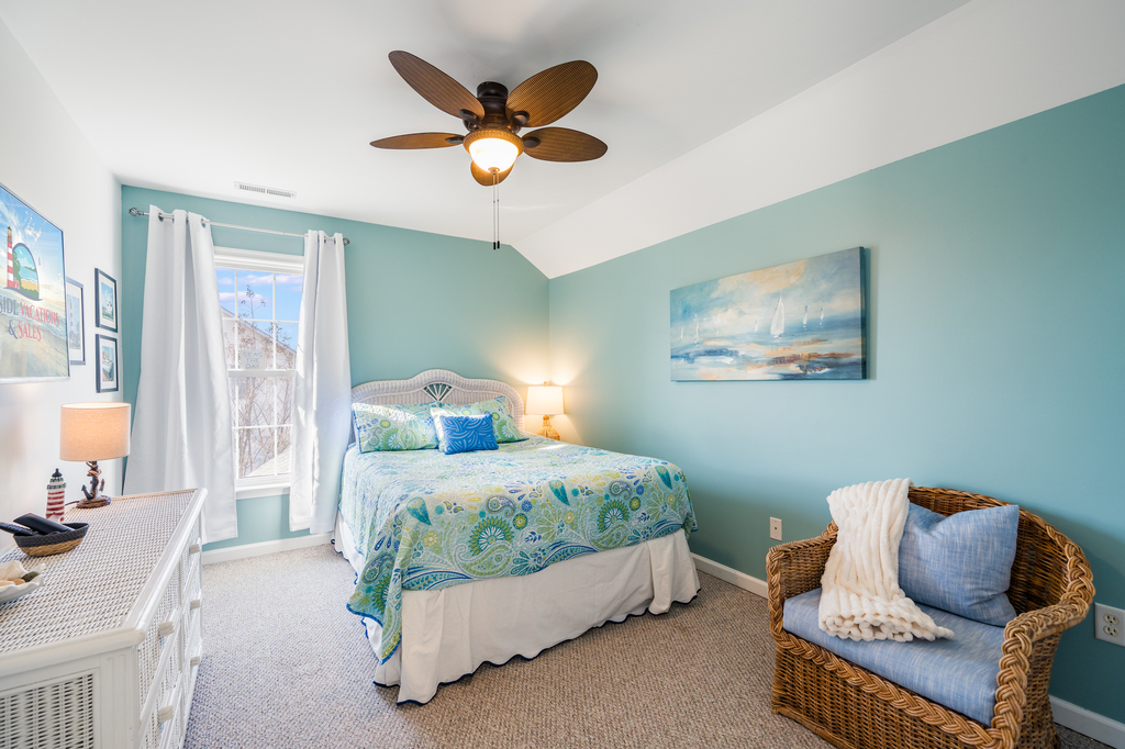 Upstairs, Bedroom 2 has a Queen Bed and gorgeous coastal colors.
