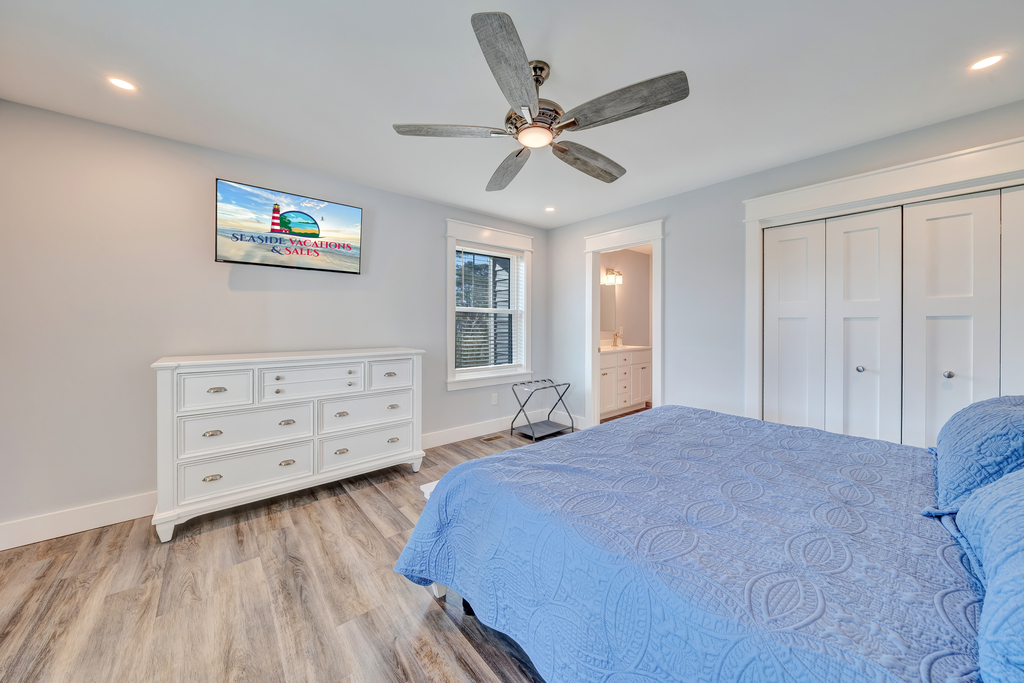 Dressed in blues, it has a King Bed and Flat Screen Smart TV.