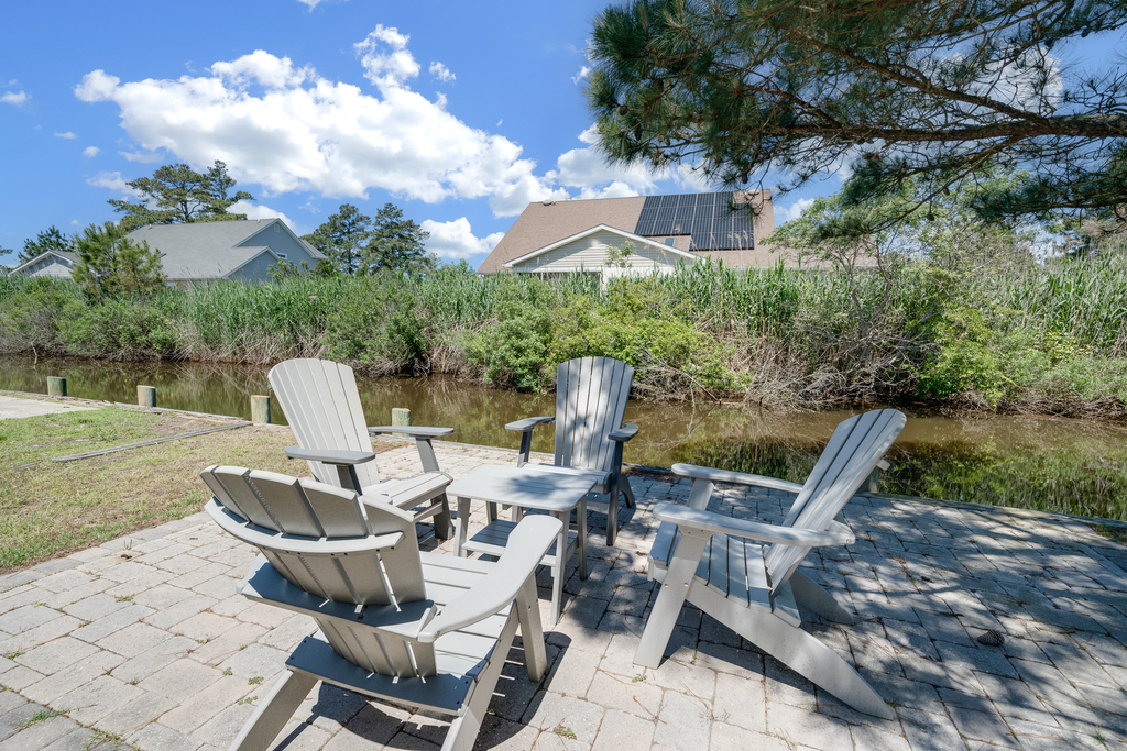 Relax and take in serene Views of the Tidal Pond in the backyard.