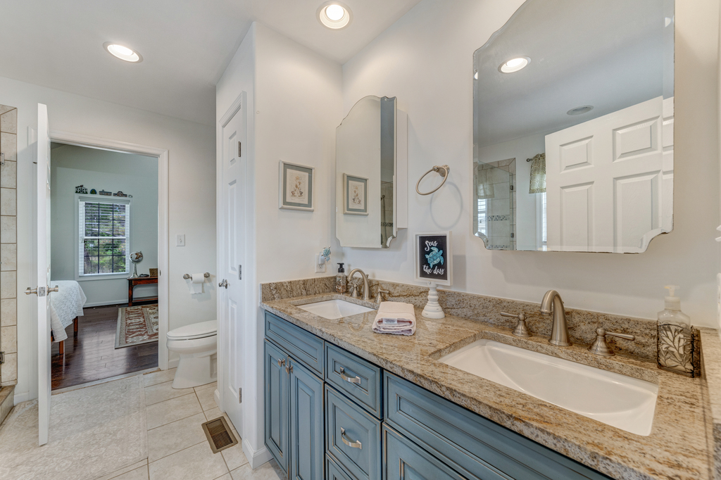 Jack and Jill Full Bath has Double Vanities and Granite Countertop.