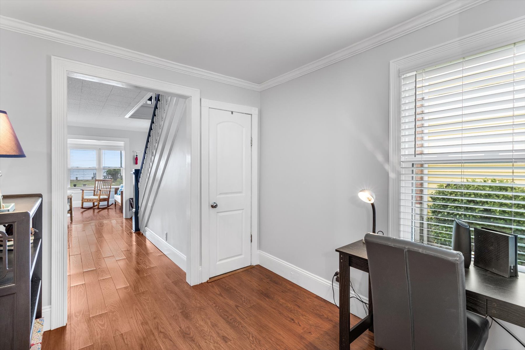 Down the Hall, you'll find a Work Station that leads to the Kitchen and Dining Areas.