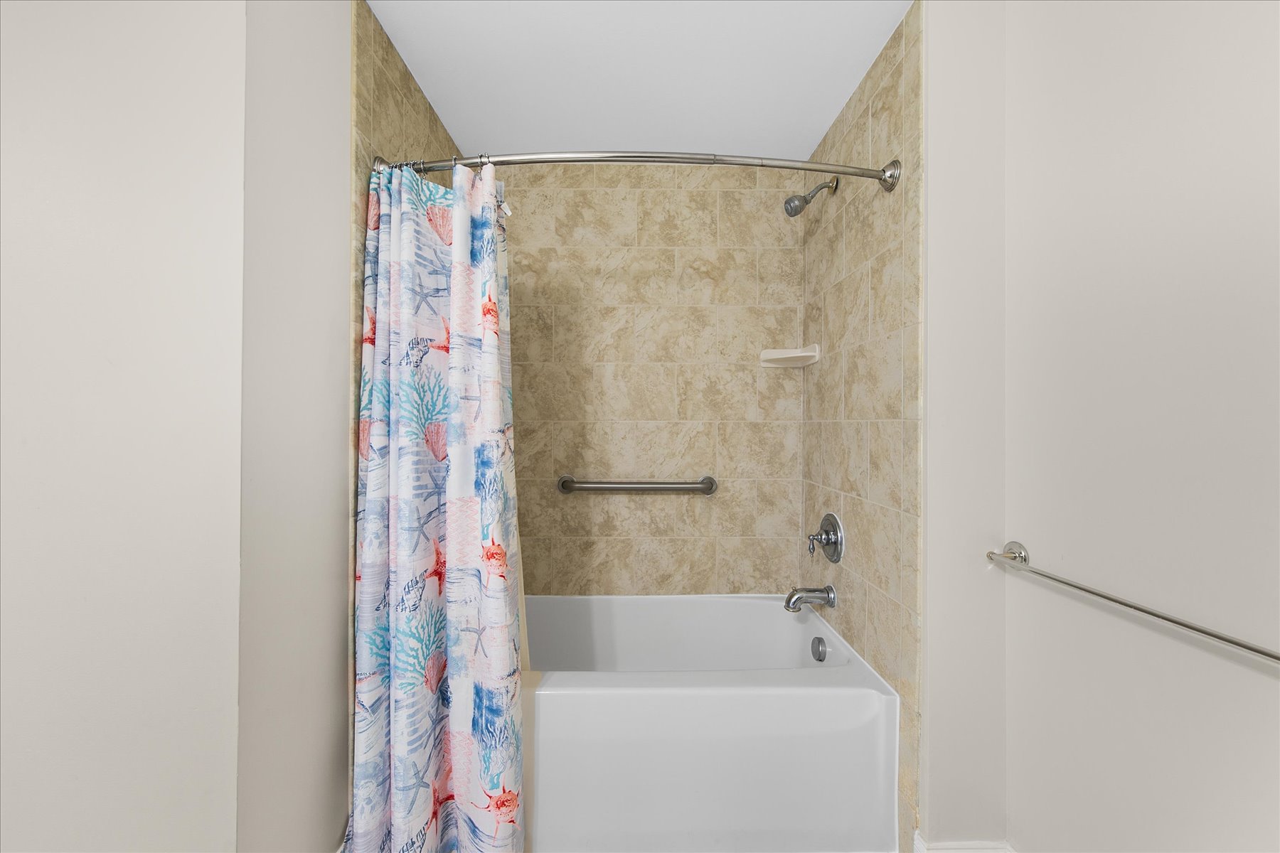 Shared full bath features Shower/Tub Combo.