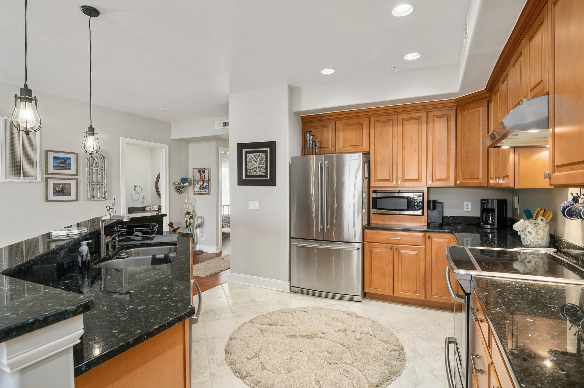 Stainless Appliances and Warm Wood Cabinetry.