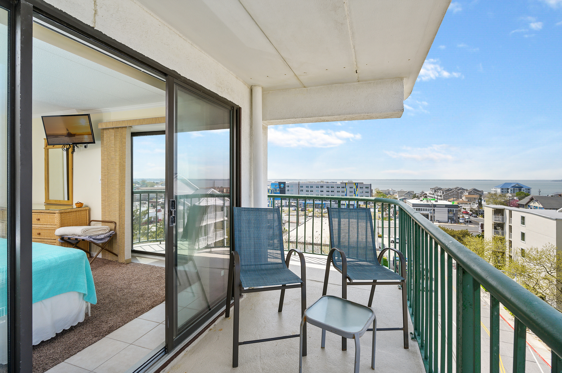 Bedroom 1's balcony offers sweeping views of both the ocean and the bay!