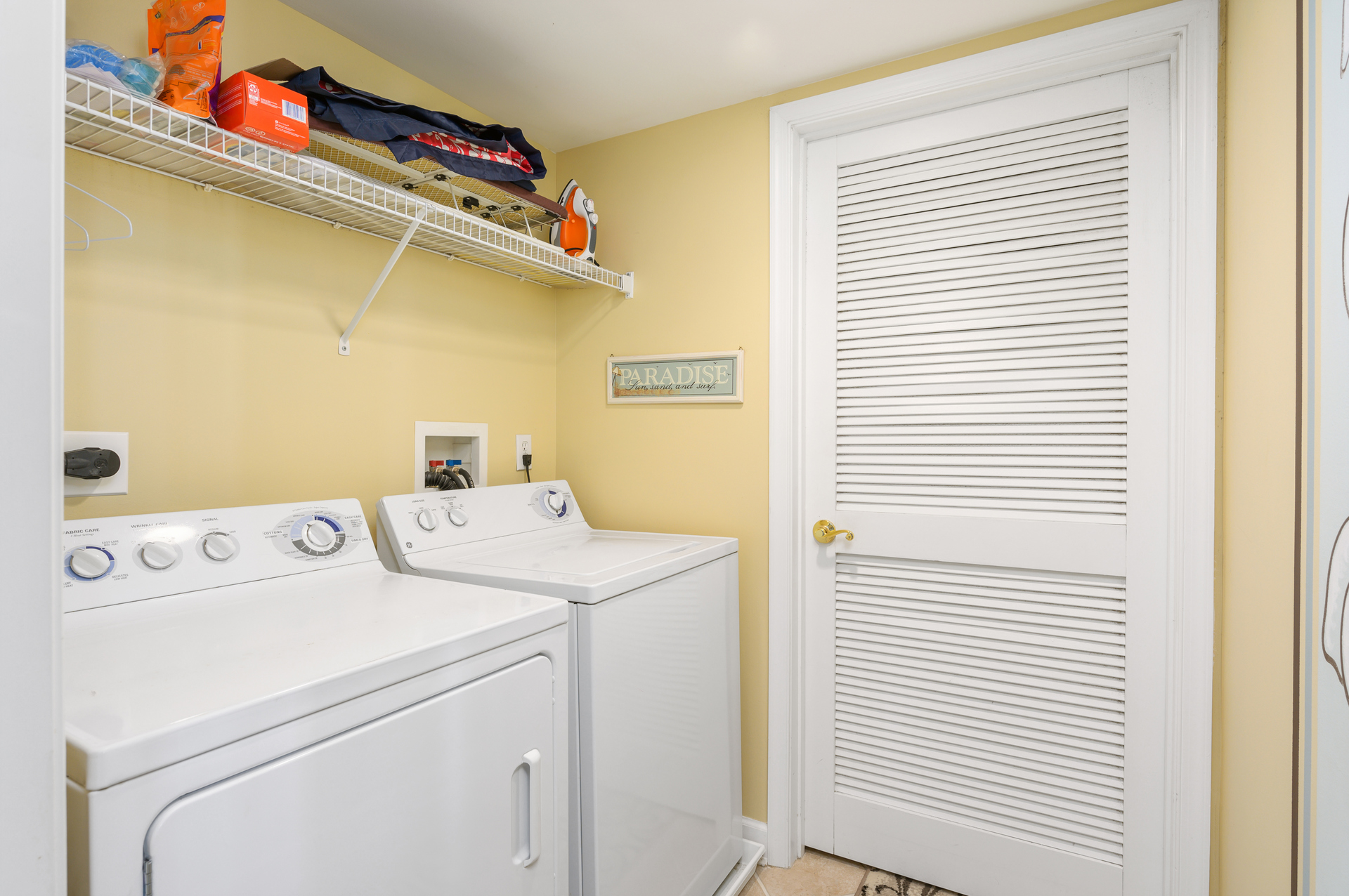 Need to do a little laundry? No problem with this laundry room and full-size washer/dryer