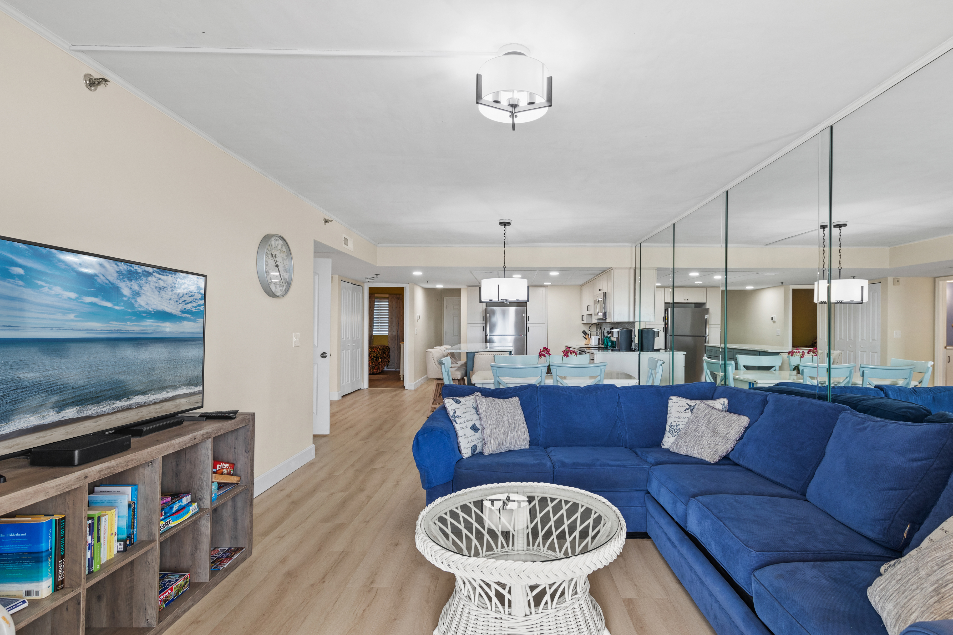 As you enter, you are welcomed into the Den with a clean, crisp decor and Beachy Floors giving this home a positively serene feel.