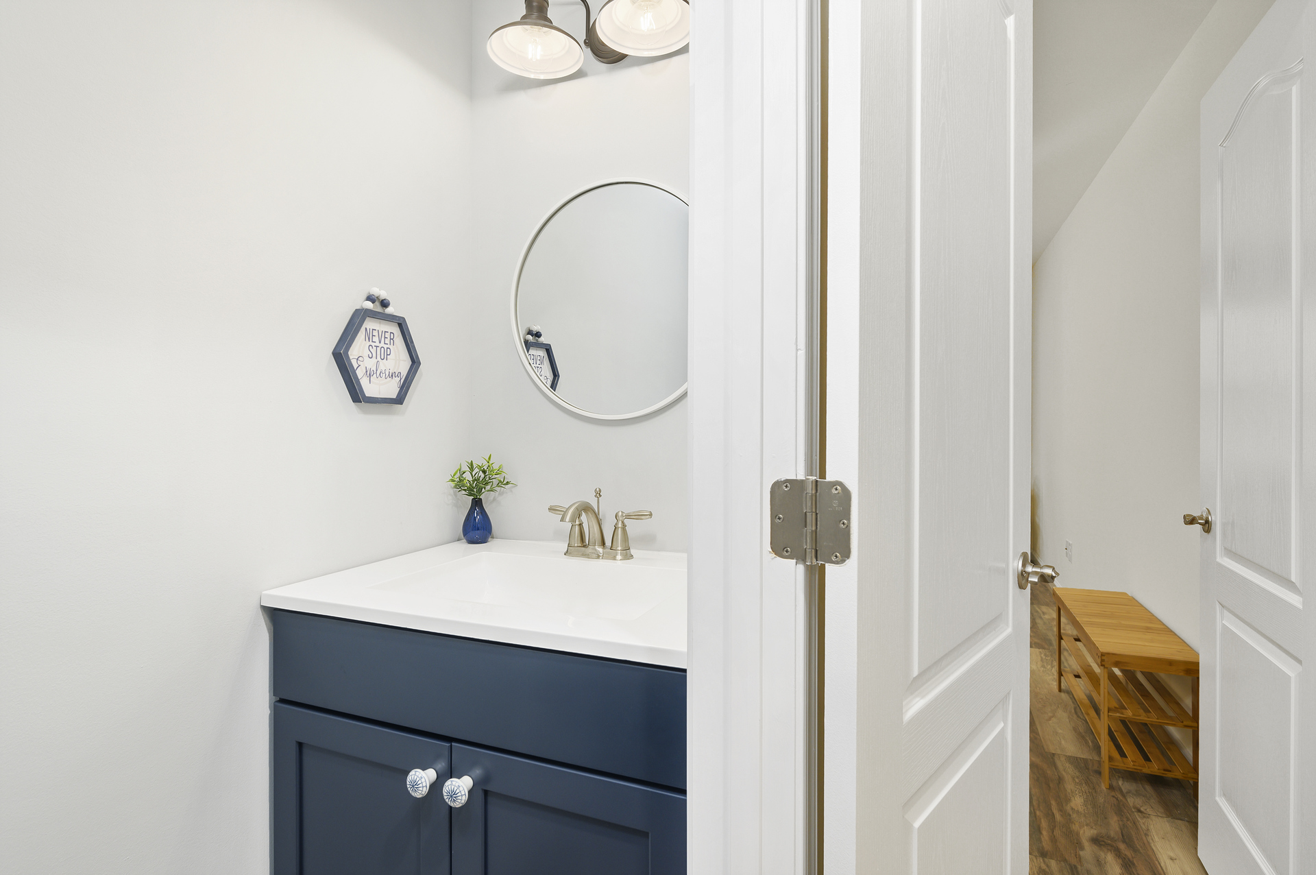 Convenient Half Bath is just off the Kitchen and Living Area.