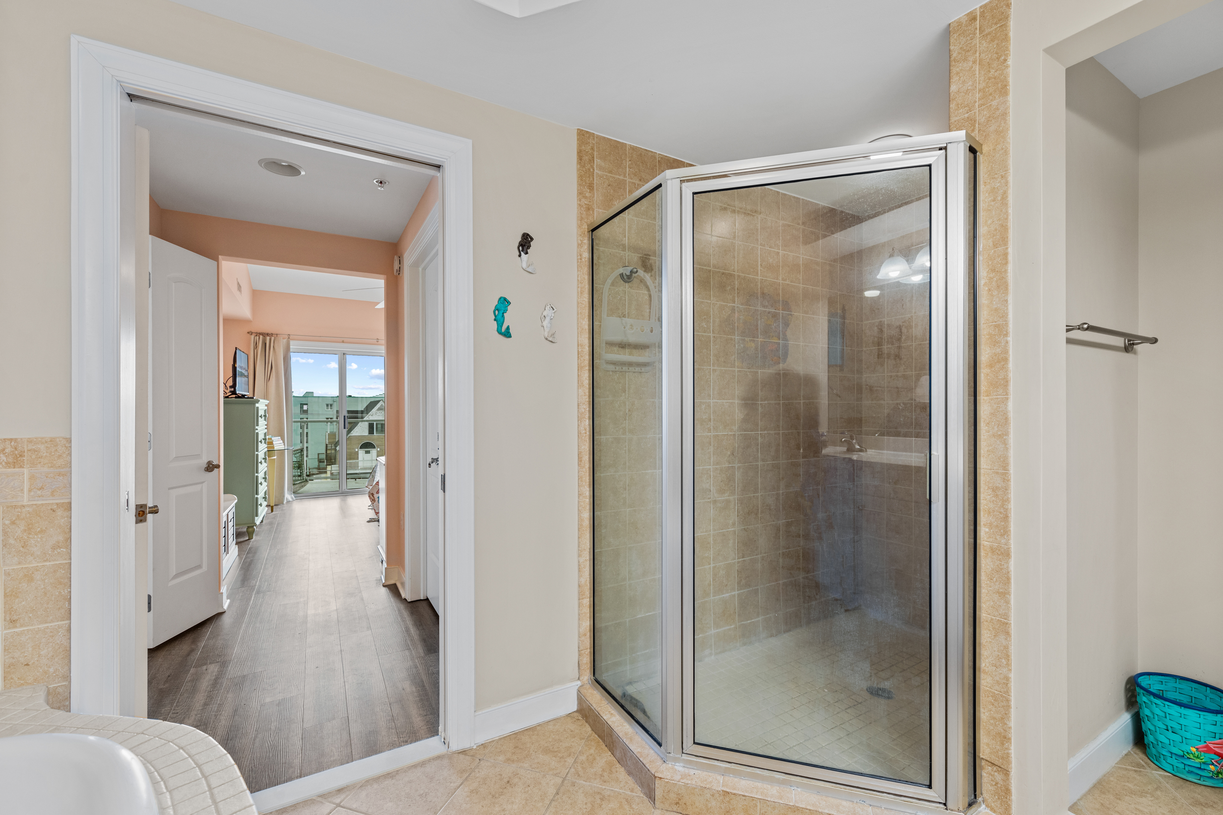 The Primary Bath is the perfect space to Relax after a Fun-Filled Beach Day.