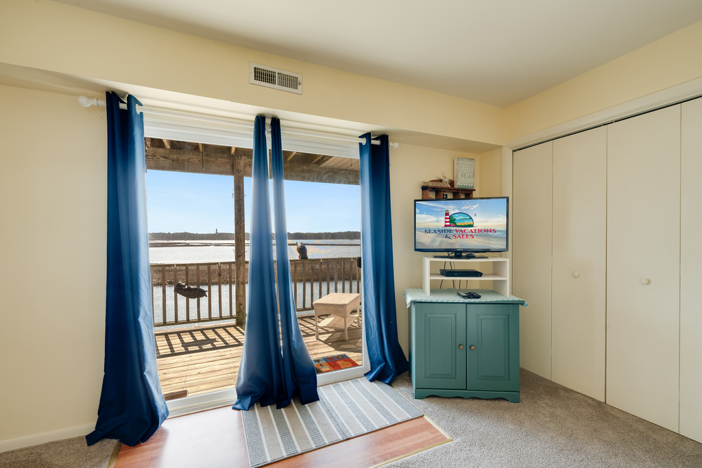 Waterfront Balcony and Flat Screen TV in Bedroom 1.