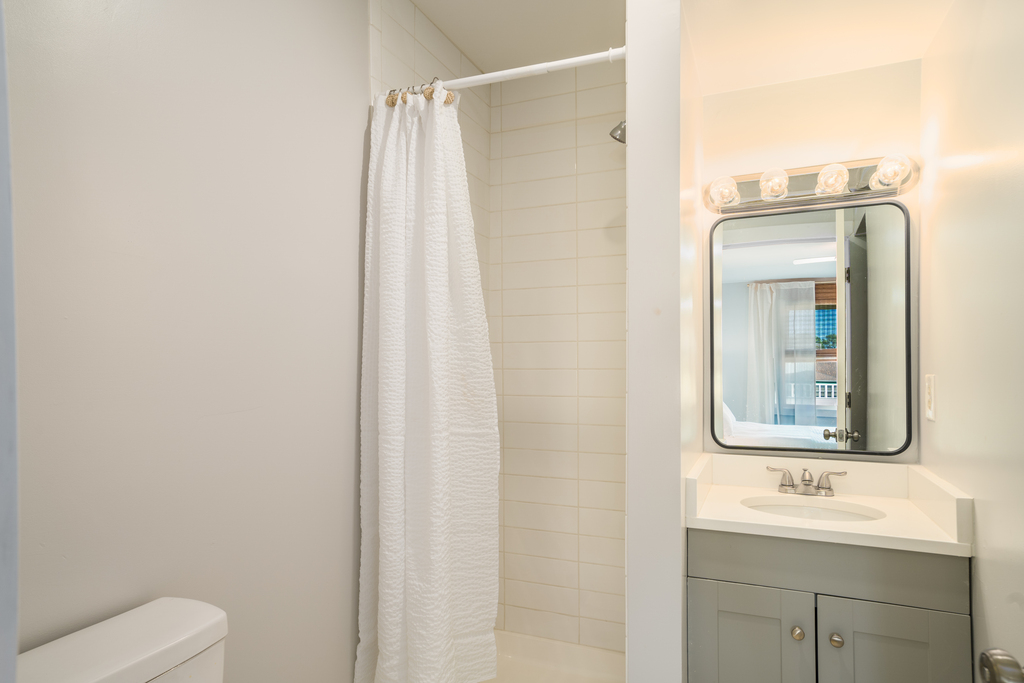 Private Attached Bath with Walk-in Shower in Bedroom 1.