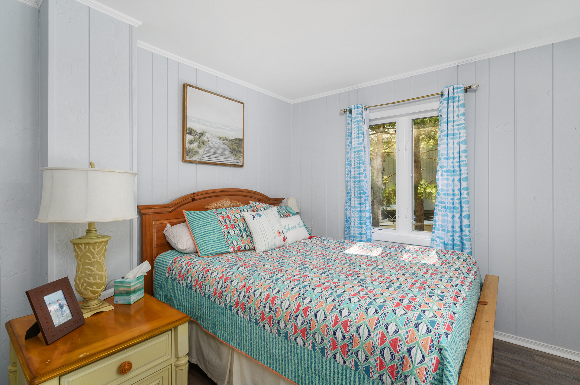 Beachy Bedroom 2 has a Queen Bed and TV.