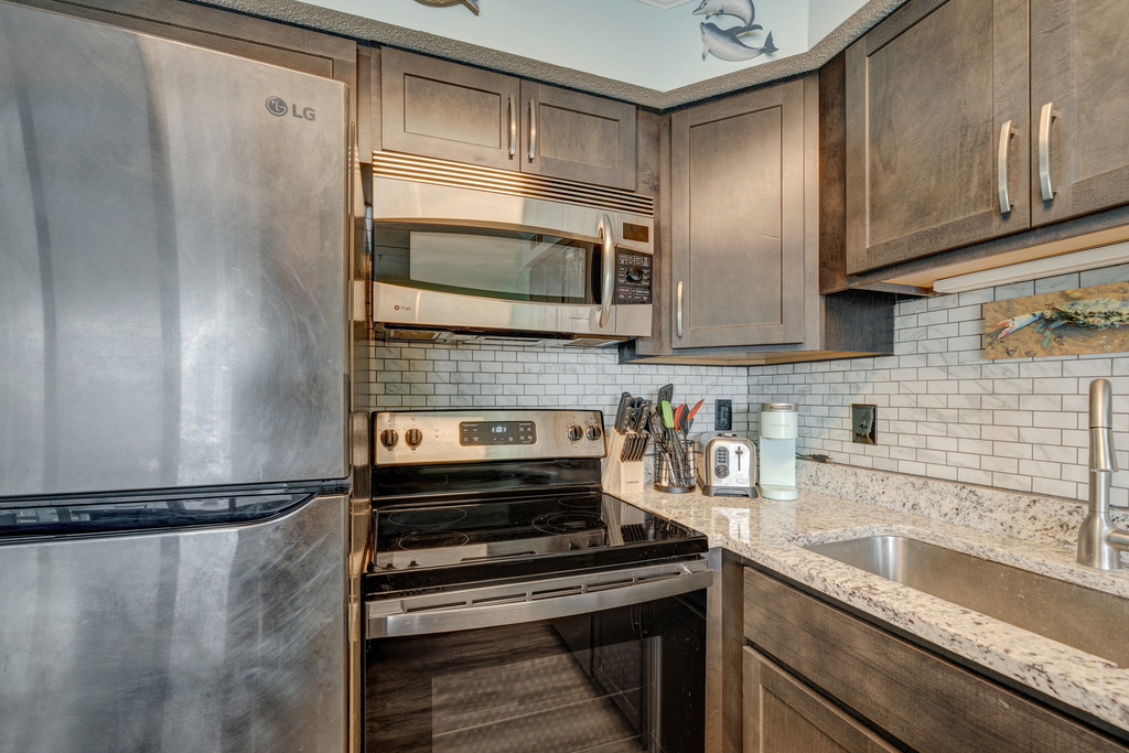 Beautifully updated kitchen with stainless steel appliances.